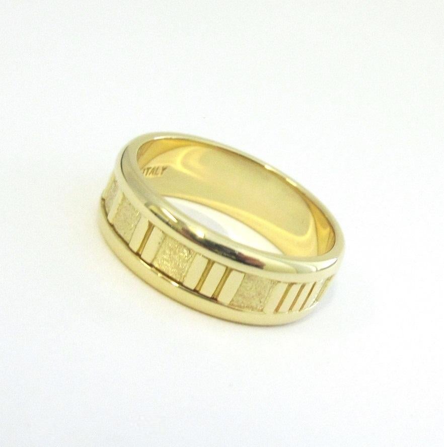 TIFFANY & CO. Atlas 18K Gold Numeric Ring 9.5

Metal: 18K Yellow Gold
Size: 9.5 
Band Width: 7mm
Weight: 9.20 grams
Hallmark: TIFFANY&CO.©1995 750 ITALY

Limited edition, no longer available for sale in Tiffany stores

Authenticity Guaranteed