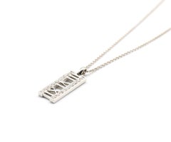 Tiffany & Co. Atlas, collier pendentif en or blanc 18 carats avec barre de diamants naturels