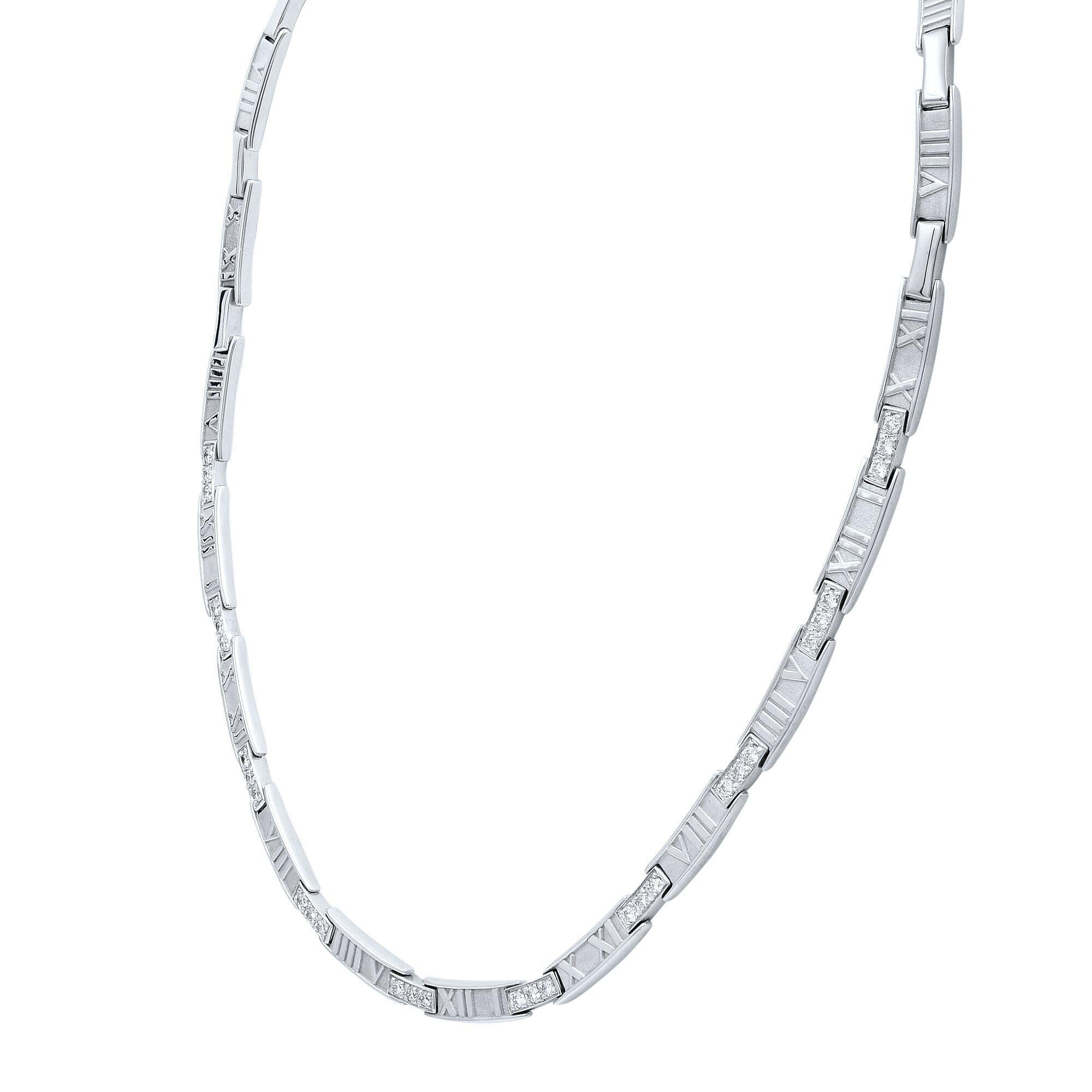 18k white gold and diamond Tiffany & Co necklace from the Atlas collection. The necklace features the atlas motif alternating with plain white gold bars half way down, the other half has 3 round brilliant cut diamonds in a pave setting with an