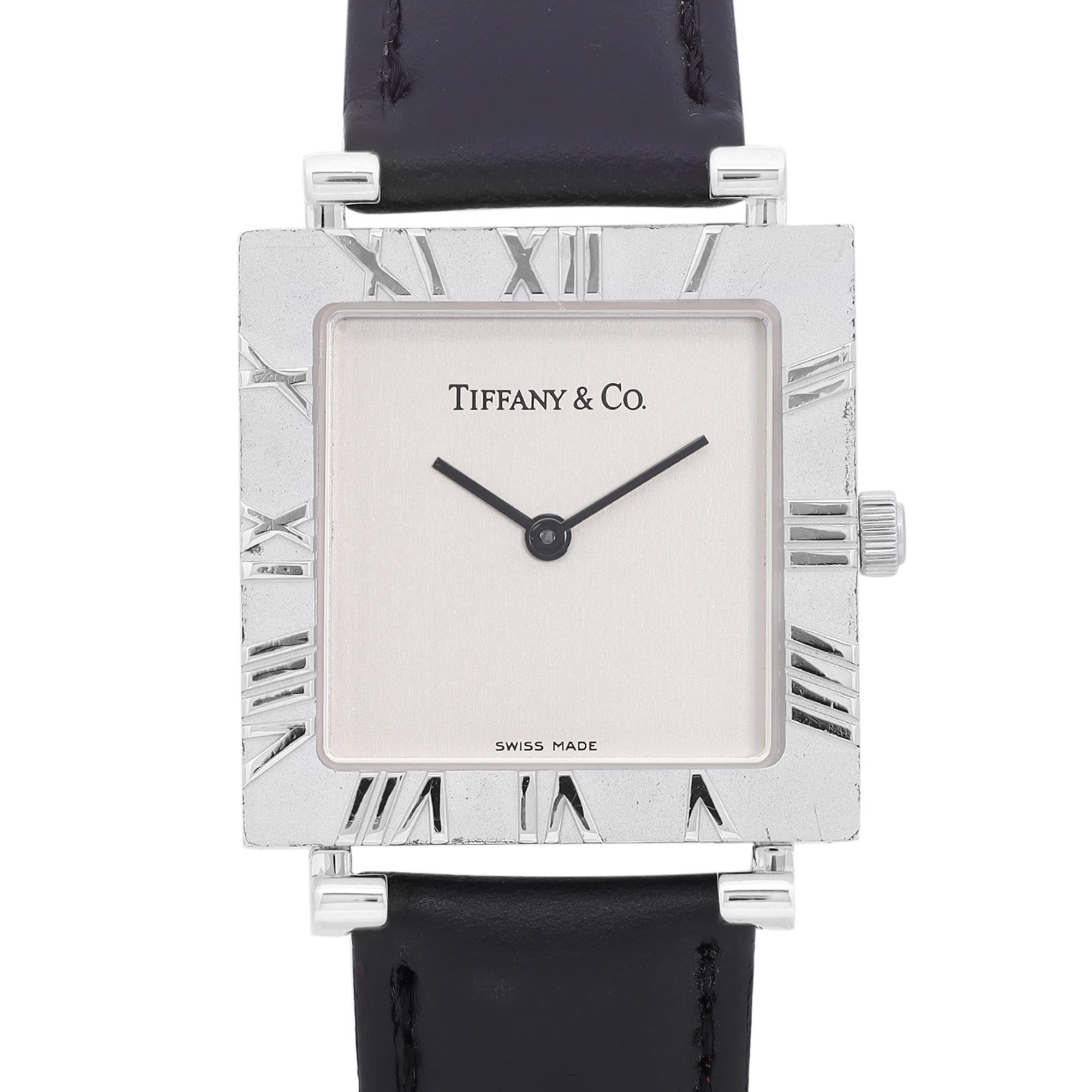 Aftermarket strap with original buckle.

Pre-Owned Tiffany & Co. Atlas 33mm Sterling Silver Leather Gray Dial Quartz Men's Watch. This Beautiful Timepiece Features: Sterling Silver Case with a Black Leather Strap, Fixed Dial with Ramen Numeral Hour