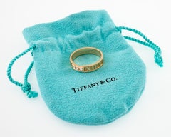 Tiffany & Co. Atlas Band Ring with Three Diamonds and Pouch in Yellow Gold
