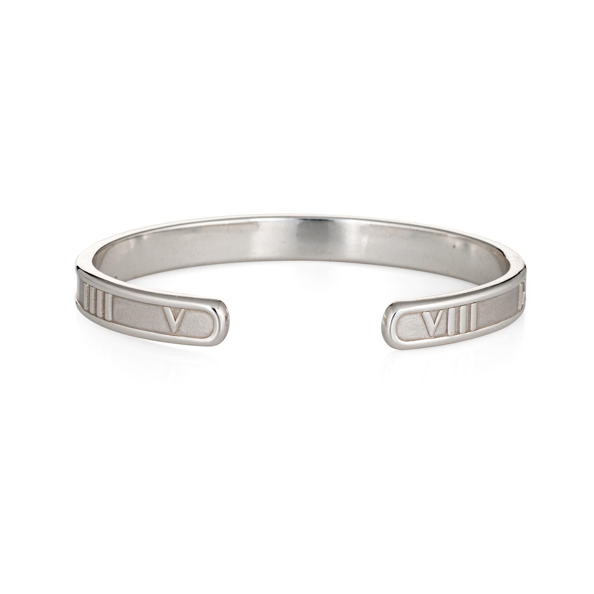 Stylish and finely detailed vintage Tiffany & Co Atlas cuff bracelet crafted in sterling silver.  

The cuff bracelet features Roman Numerals. The bracelet is great worn alone or layered with your fine jewelry from any era.  

The bracelet is in