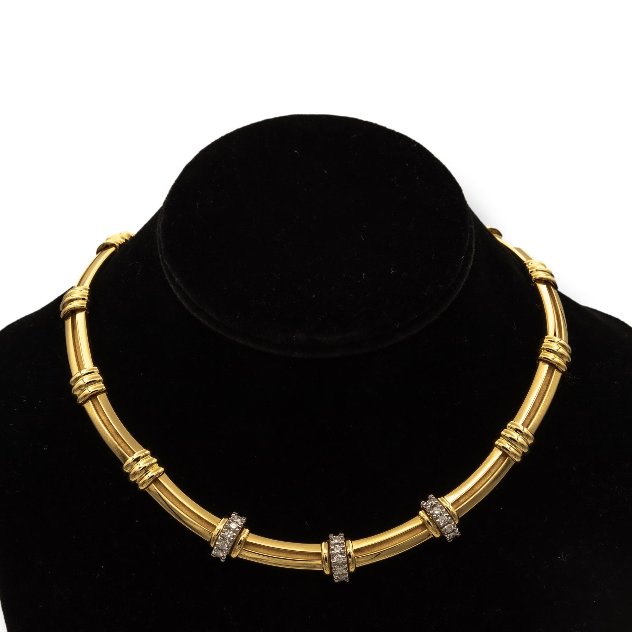 Tiffany & Co. Vintage Atlas choker necklace finely crafted in 18 karat yellow gold with 3 diamond stations set in platinum. The diamond stations are set with 15 round brilliant cut diamonds weighing 0.75 carats total weight approximately.  E-F color