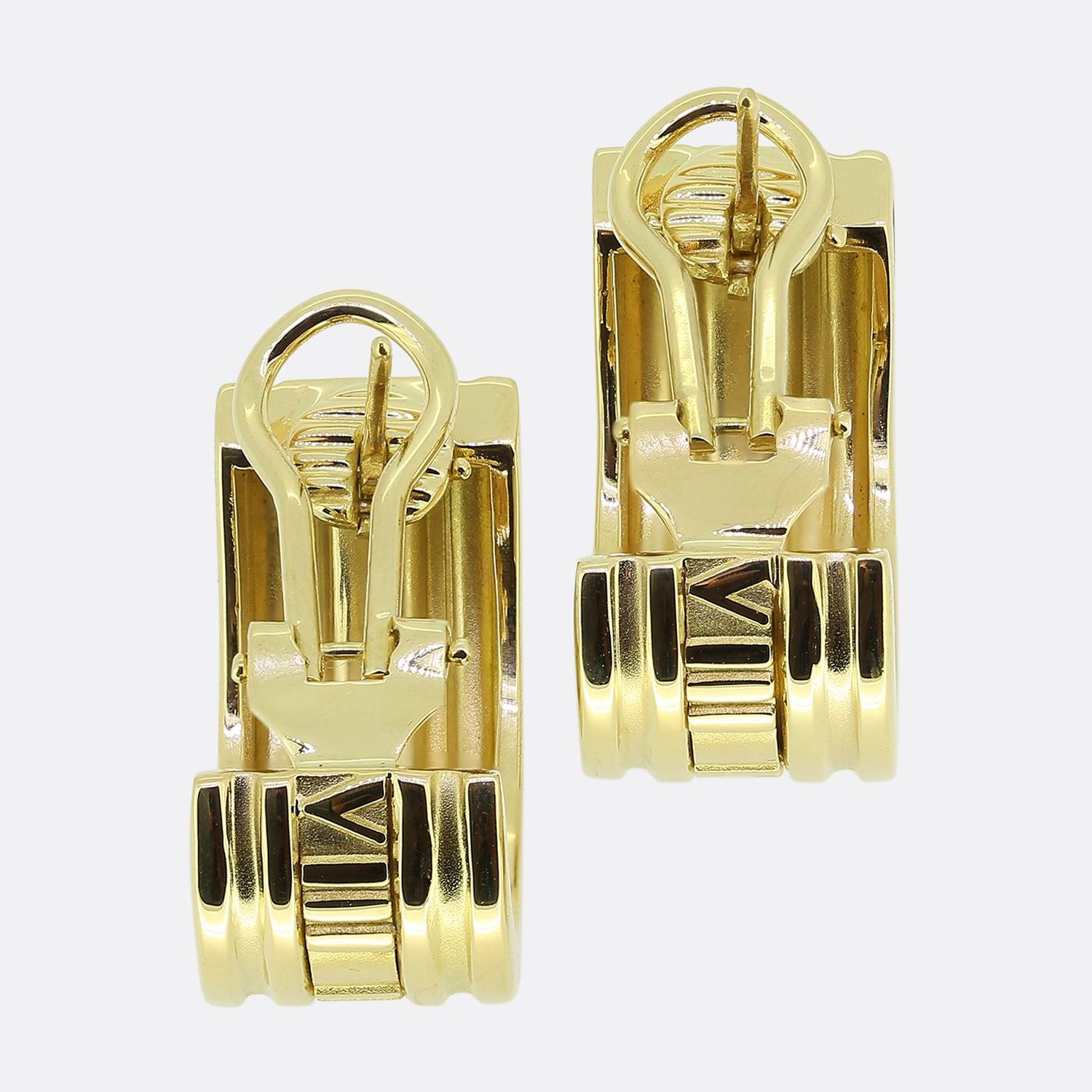 Here we have a classic pair of half-hoop earrings from the world renowned jewellery designer, Tiffany & Co. These earrings form part of their Atlas collection, have been crafted from 18ct yellow gold and showcase the iconic Roman numeral design
