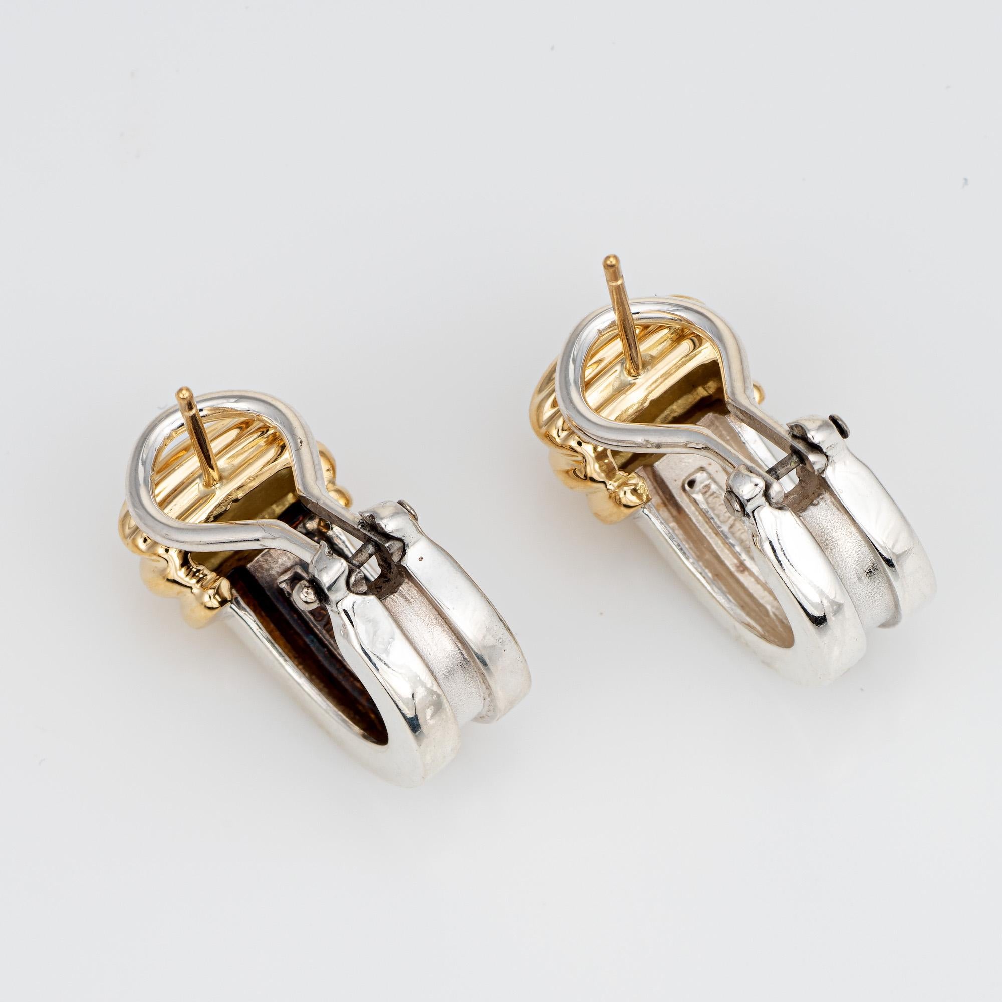 Finely detailed pair of vintage Tiffany & Co Atlas earrings (circa 1995) crafted in sterling silver & 18k yellow gold. 

From the popular Atlas collection, the stylish earrings are crafted in sterling silver with 18k yellow gold accents. The retired