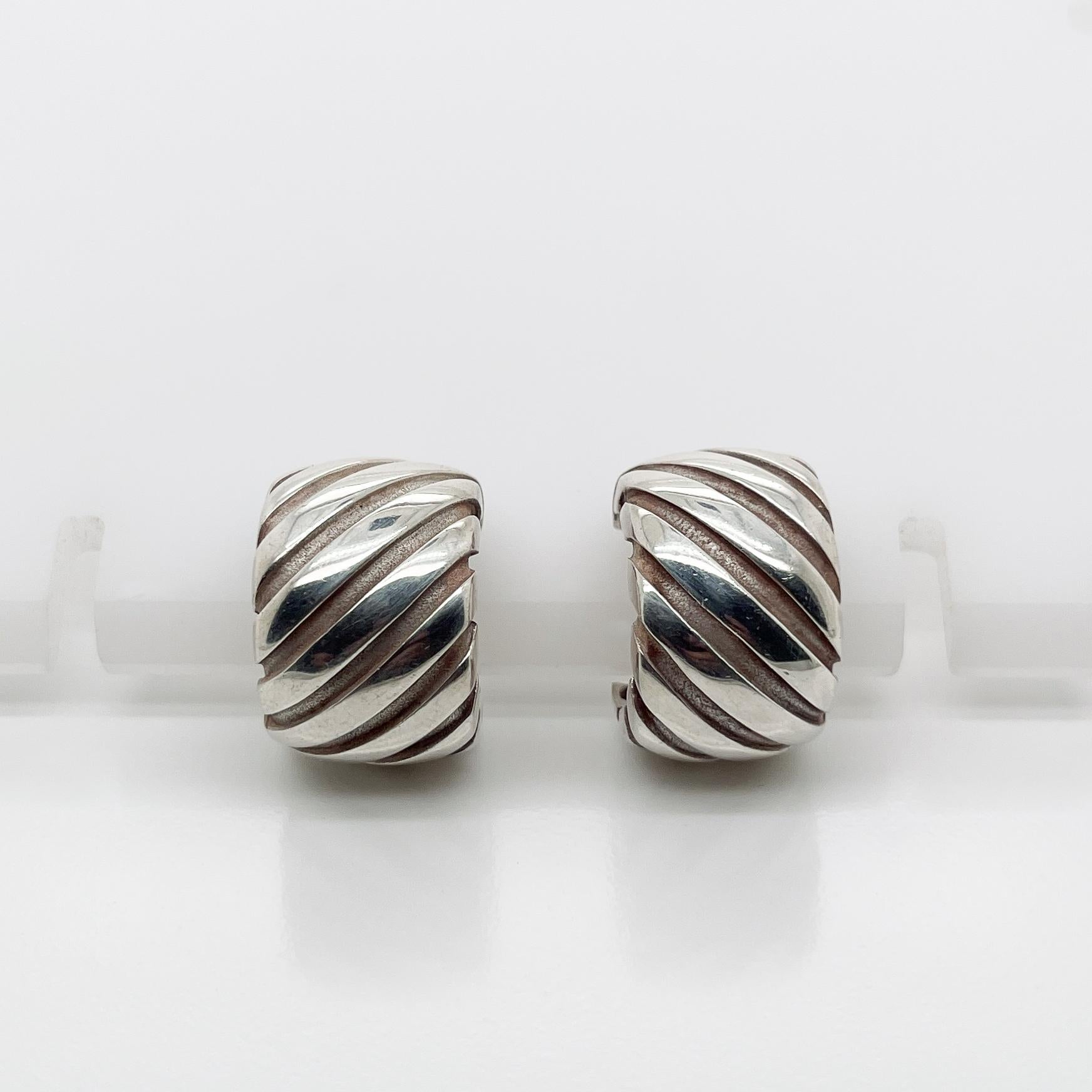 A very fine pair of 'Atlas' Groove Stripe clip-on earrings.

In sterling silver.

By Tiffany & Co.

Simply a wonderful pair of earrings from Tiffany!

Date:
20th Century

Overall Condition:
It is in overall good, as-pictured, used estate condition
