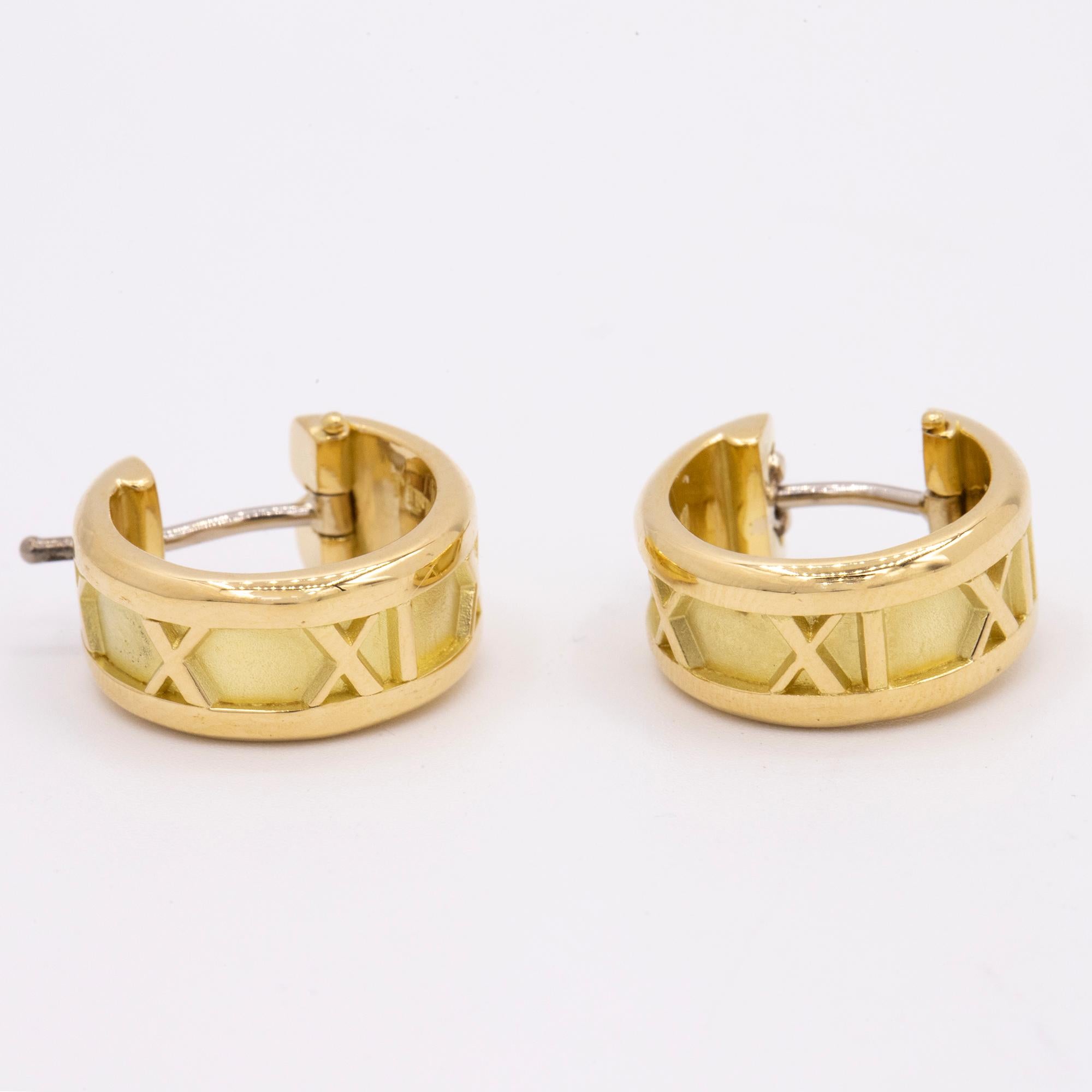 Tiffany & Co Atlas huggie earrings made out of 18kt yellow gold. Standard size.