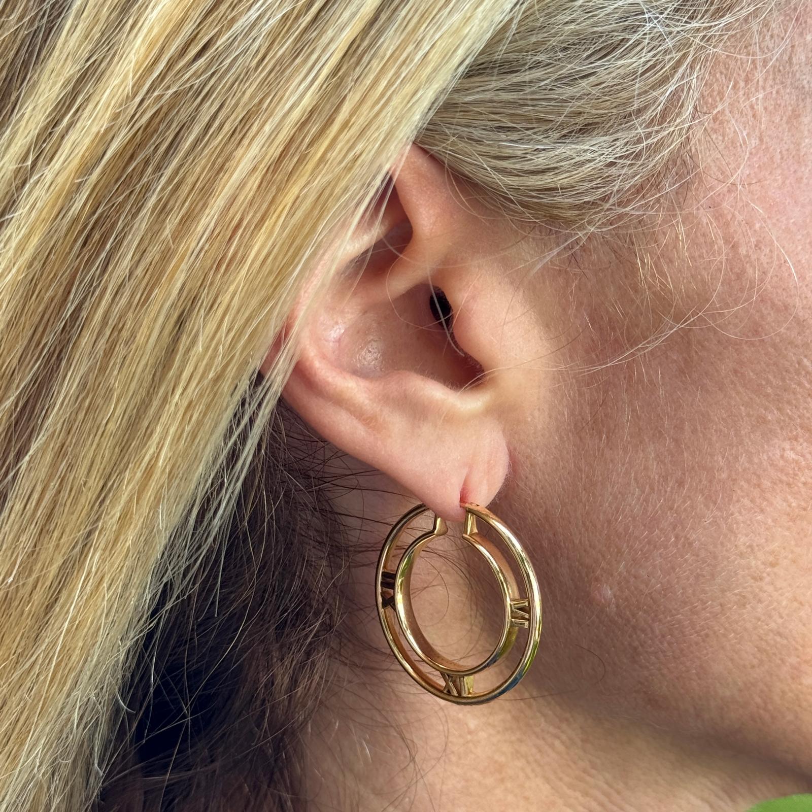 These Tiffany & Co. Atlas Medallion hoop earrings are crafted in luminous 18K rose gold and feature the collection’s signature Roman numeral motif, inspired by the iconic Atlas clock above the Tiffany Fifth Avenue flagship. The elegantly sculpted