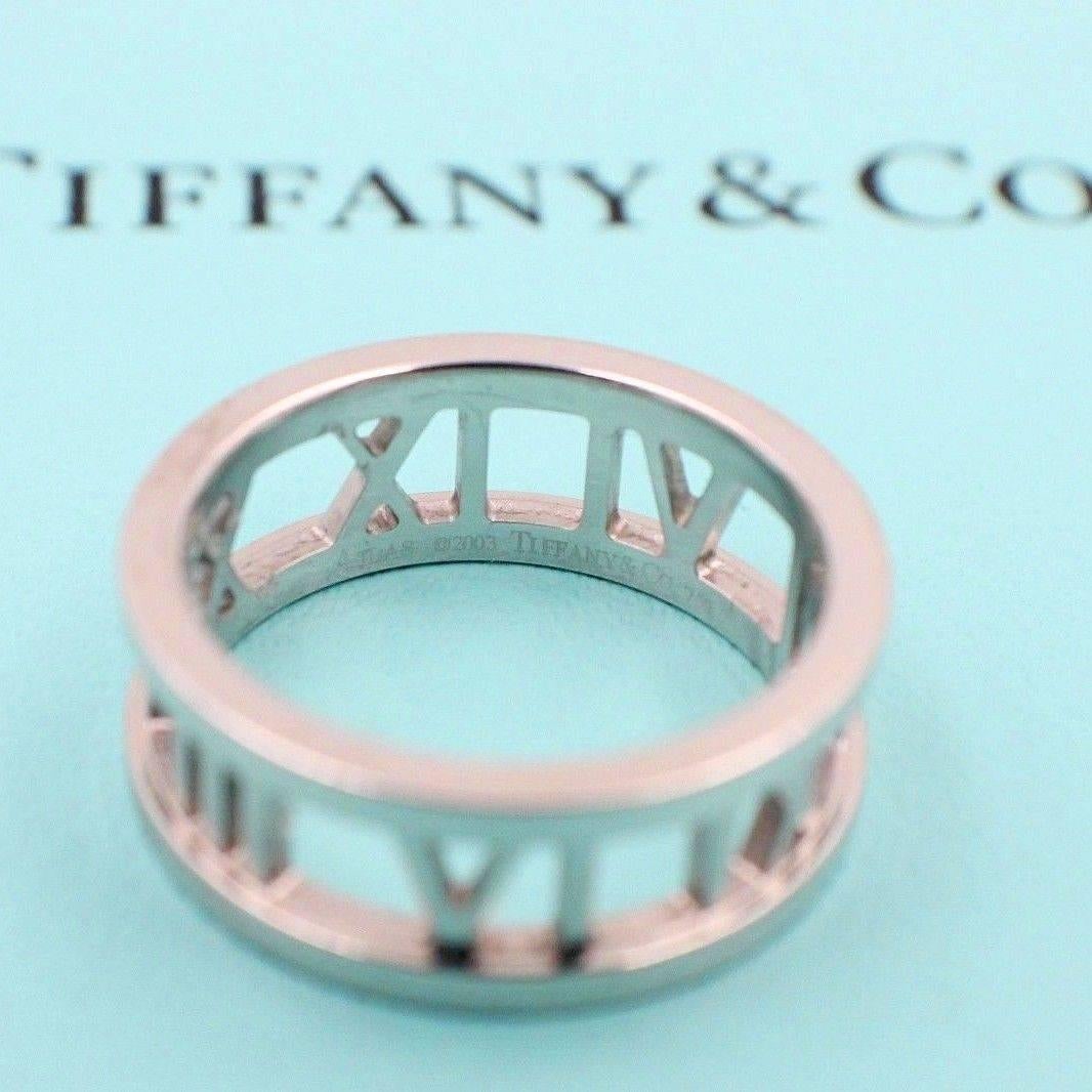 Tiffany & Co.
Style:  Atlas Open Band Ring
Sku Number:   18531291
Metal:  18KT White Gold
Width:  7 MM
Size:  8.5
Hallmark:  ATLAS ©2003 TIFFANY&CO. 750
Includes:  Tiffany & Co. Jewelry Pouch

Retail Value:  $1,400 + Tax = $1,508.50
