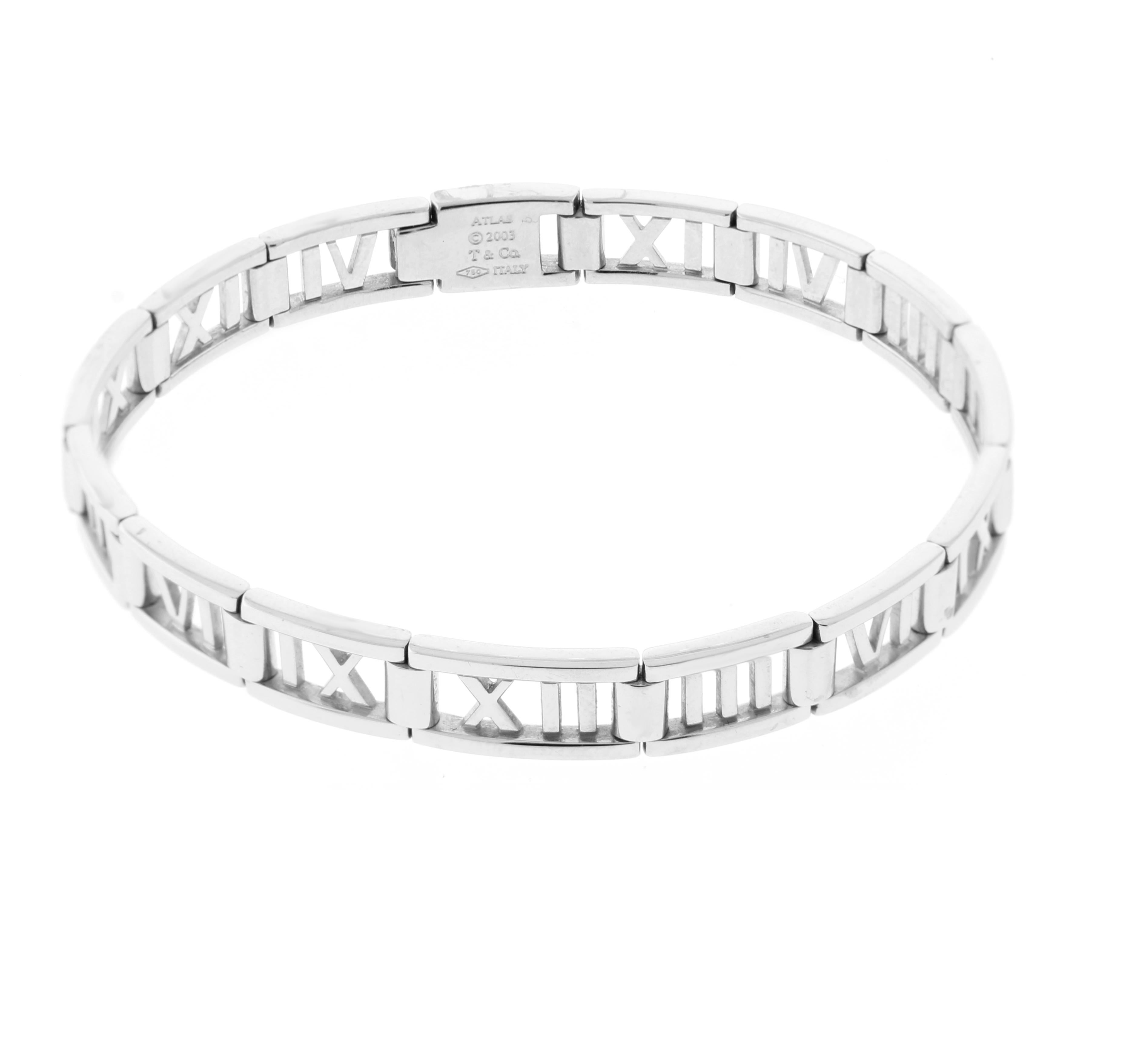 From Tiffany & Co.'s Atlas collection thier open hinged roman numeral bracelet in 18 karat white gold. The graphic motif of the Roman numeral jewelry was inspired by the Atlas clock on the facade of Tiffany’s Fifth Avenue store
♦ Designer: Tiffany &