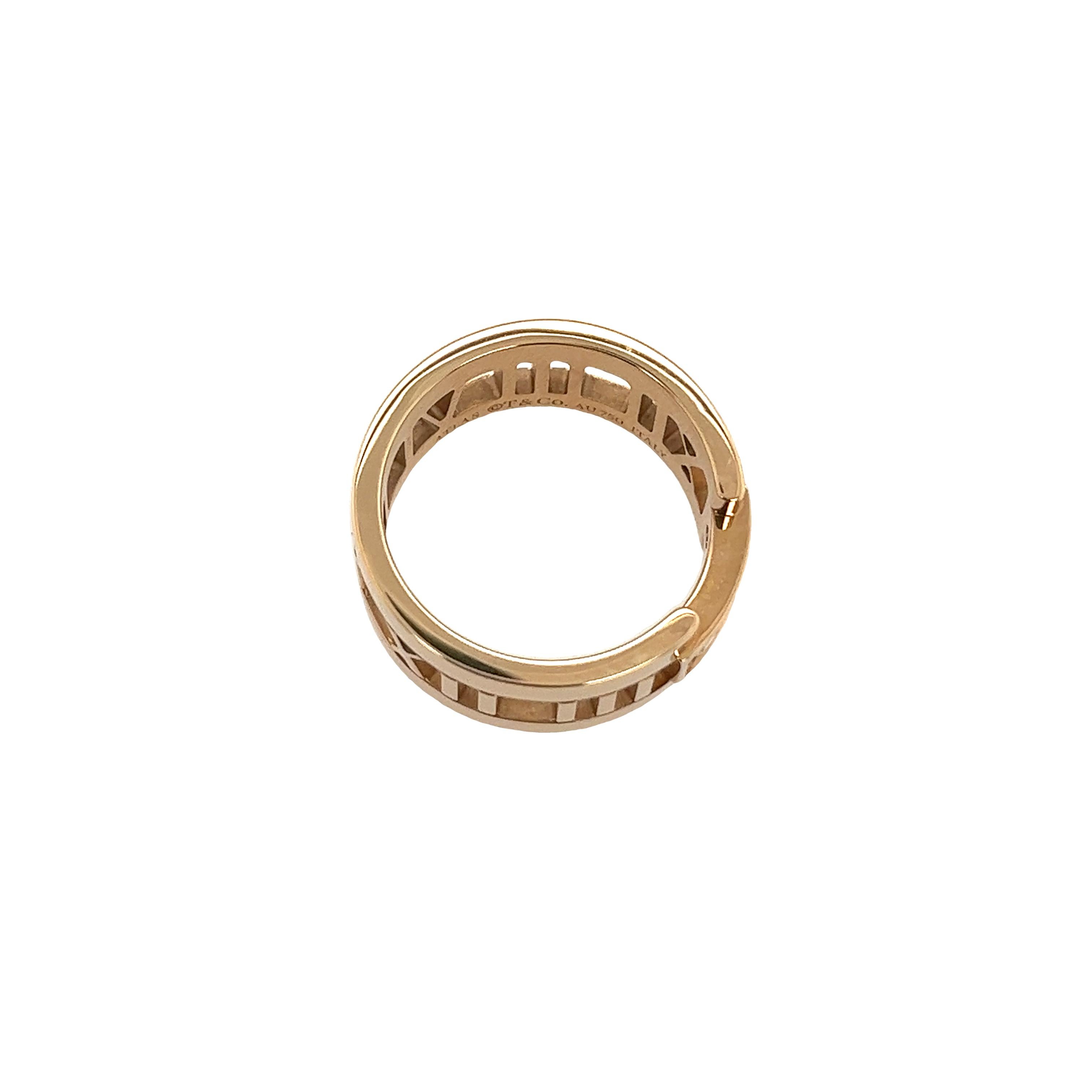 Elevate your style with this exquisite Tiffany & Co Atlas Band in 18ct Rose Gold. 
This stunning ring features a modern design with its interlocking gold bands that glimmer in any light. 
A trio of diamonds is elegantly set at the center, offering a