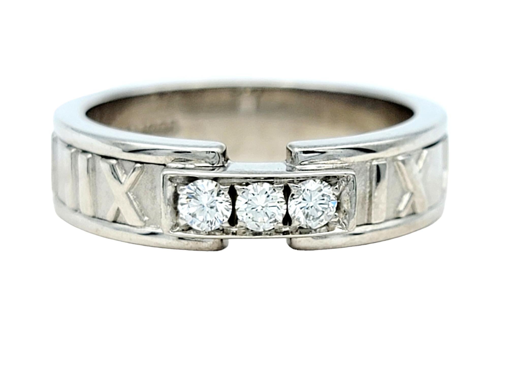 Ring Size: 7.75

This gorgeous Tiffany & Co. Atlas band ring exudes elegance and sophistication, designed with the iconic Atlas motif that symbolizes strength and timeless beauty. Crafted from lustrous 18 karat white gold, this exquisite ring