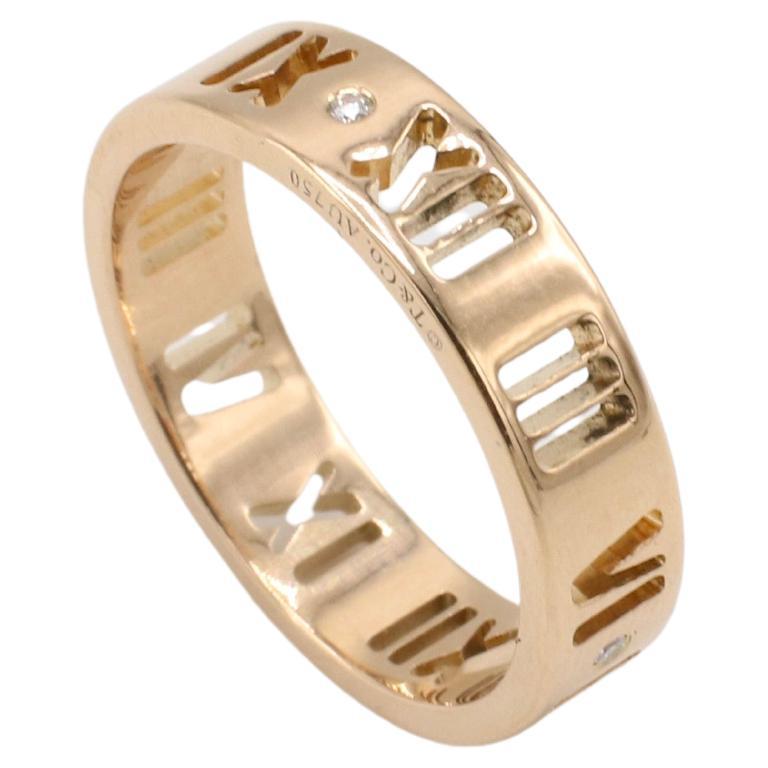 Tiffany & Co. Atlas Rose Gold Natural Diamond Pierced Band Ring 
Metal: 18k rose gold
Weight: 4.65 grams
Width: 5mm
Size: 7 (US)
Signed: ©T&Co. Au750
Diamonds: 4 round natural diamonds approx. 0.04 CTW F-G VVS
