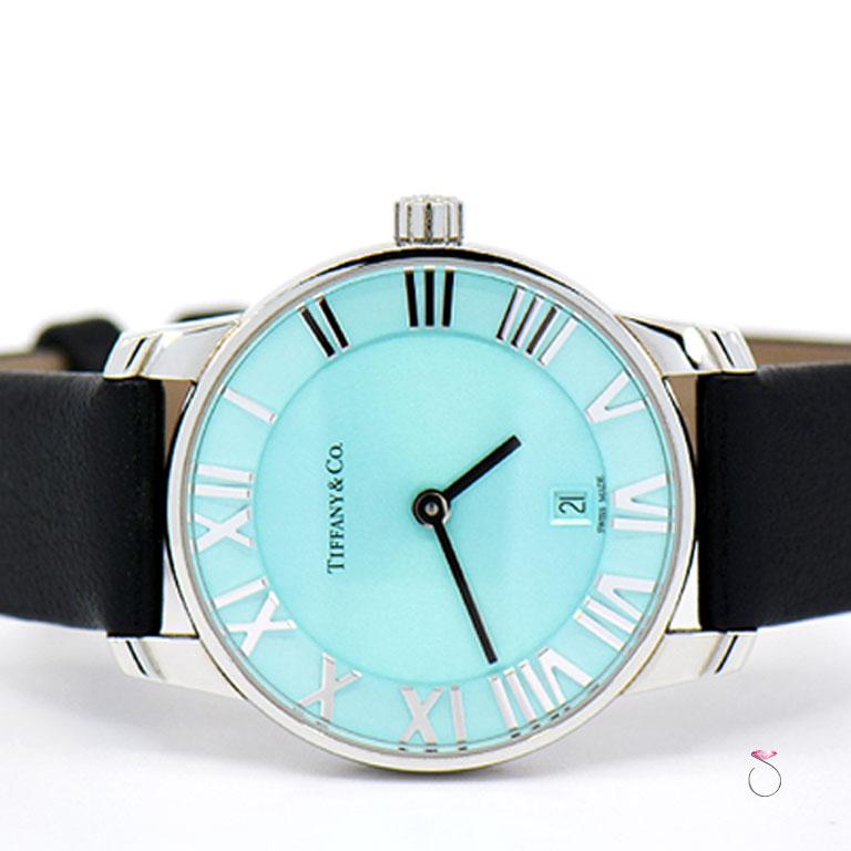 Authentic Tiffany & Co. Atlas ladies stainless steel watch. This beautiful and elegant Tiffany watch has a 29mm stainlness steel case that houses the Tiffany quartz movement. Stunning Tiffany alue azure' dial with steel Roman numeral hour markers