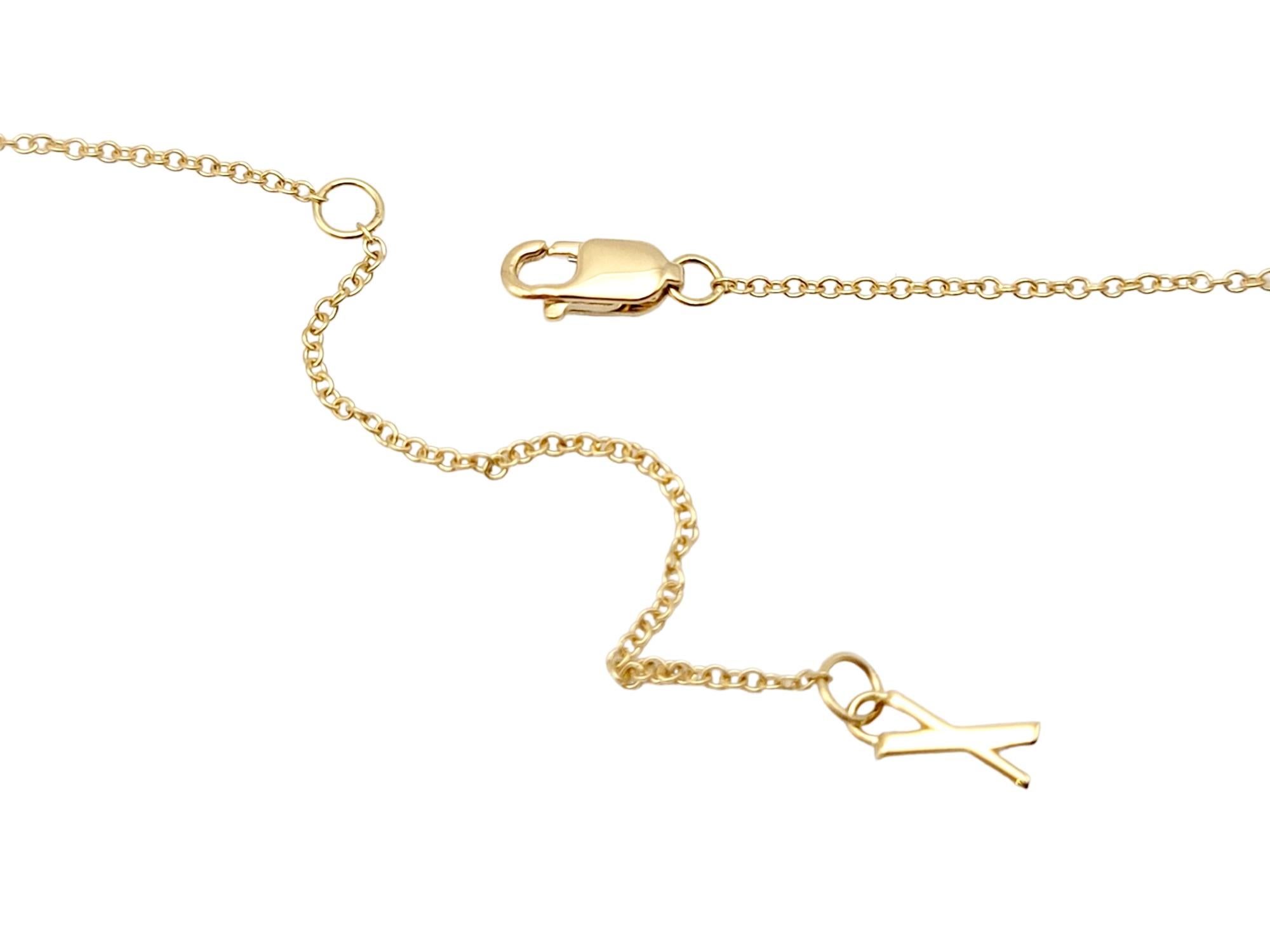 Tiffany & Co. Atlas, collier pendentif en or jaune 18 carats avec pendentif imbriqué en forme de X 5