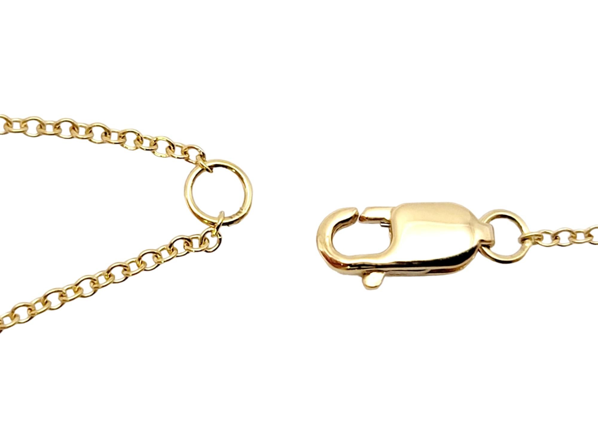 Tiffany & Co. Atlas, collier pendentif en or jaune 18 carats avec pendentif imbriqué en forme de X 4