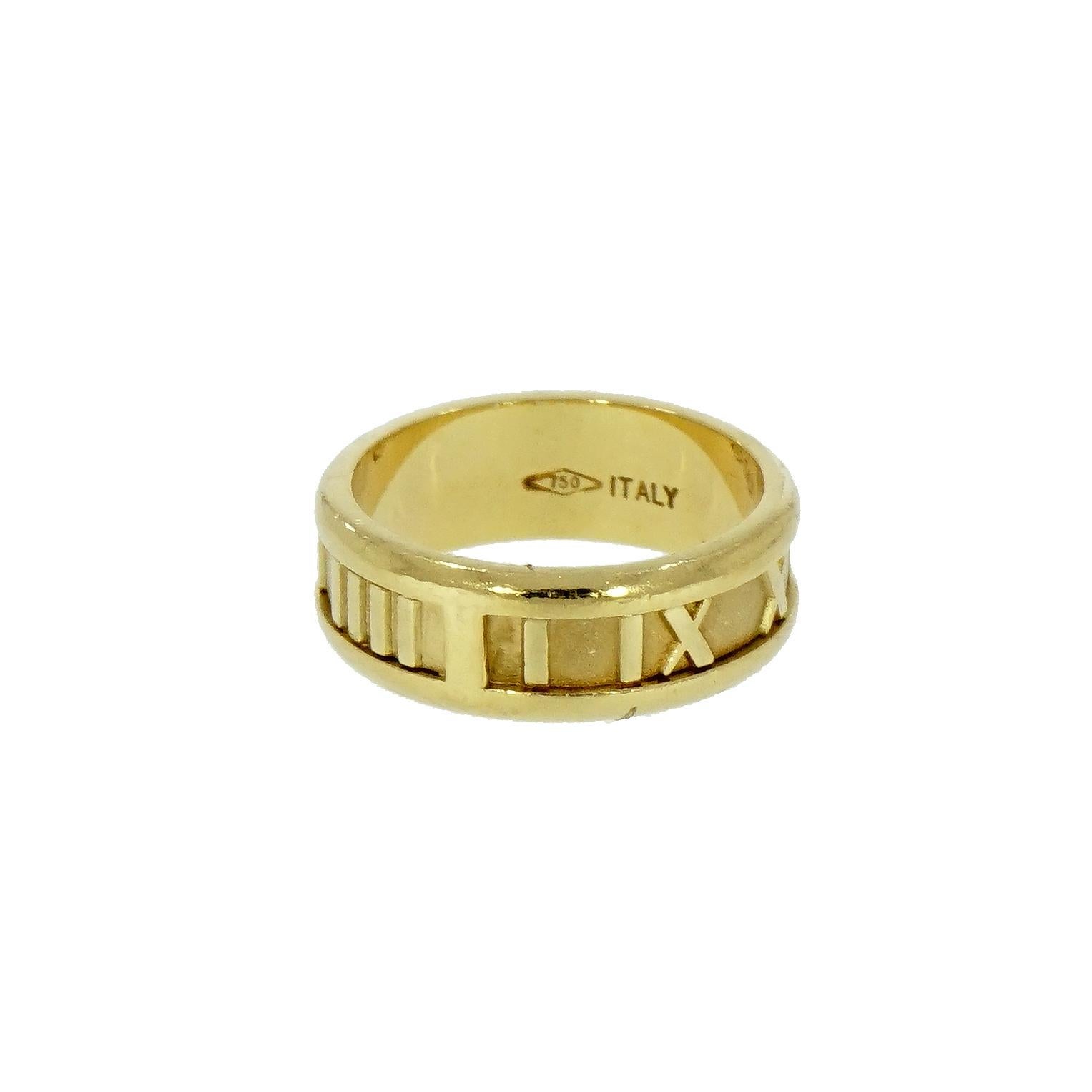 
Featuring a wide 18 karat gold band ring from the Atlas Collection by Tiffany & Co.
With Roman numerals and borders in highly polished gold, matte finish on lightly textured background
Fully signed Tiffany & Co. 1995 Italy 750 (for 18 karat