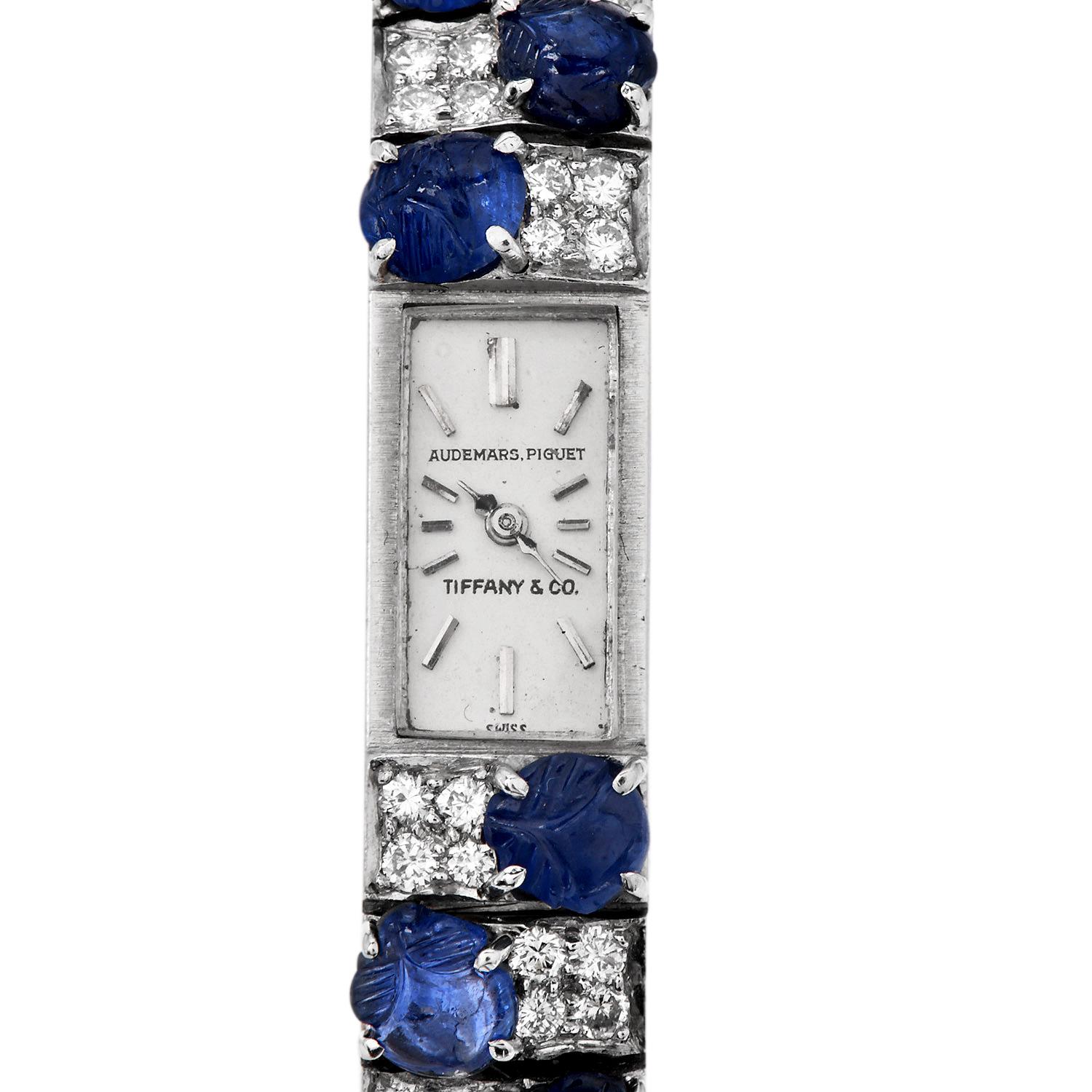 This 1960S extraordinary Tiffany & Co. and Audemars Piguet Swiss-made is platinum bracelet watch. The sleek rectangular silvered dial watch bracelet with 34 carved cabochon sapphires totaling approx. 14.00 carats, showcasing rich, vibrant blue hues.