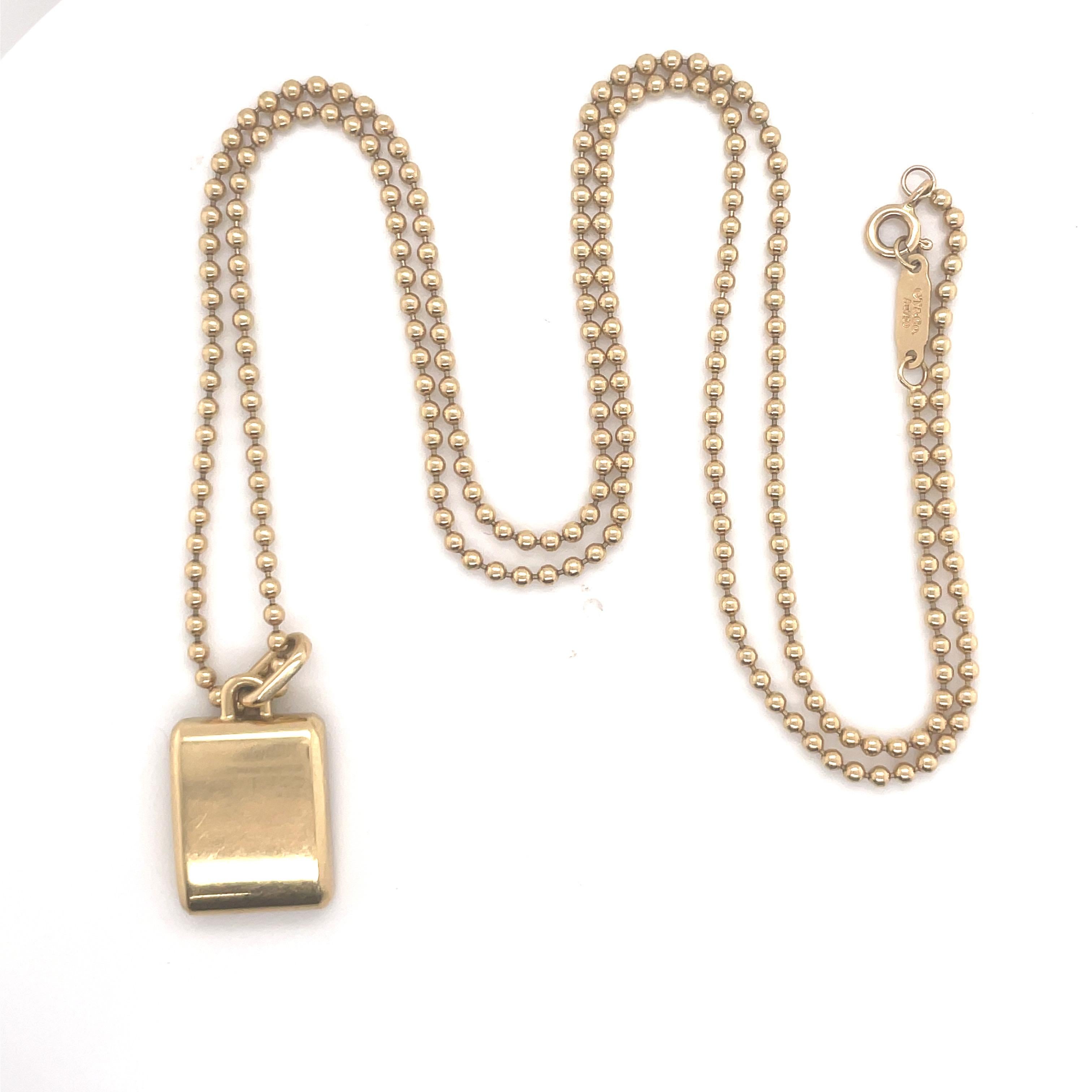 Tiffany & Co necklace featuring one Bar pendant stamped T&CO MAKERS NY 750 T weighing 25.9 grams, in 18 Karat Yellow Gold.
Can be worn with the markers mark shown or a polished bar.
Great for layering! 