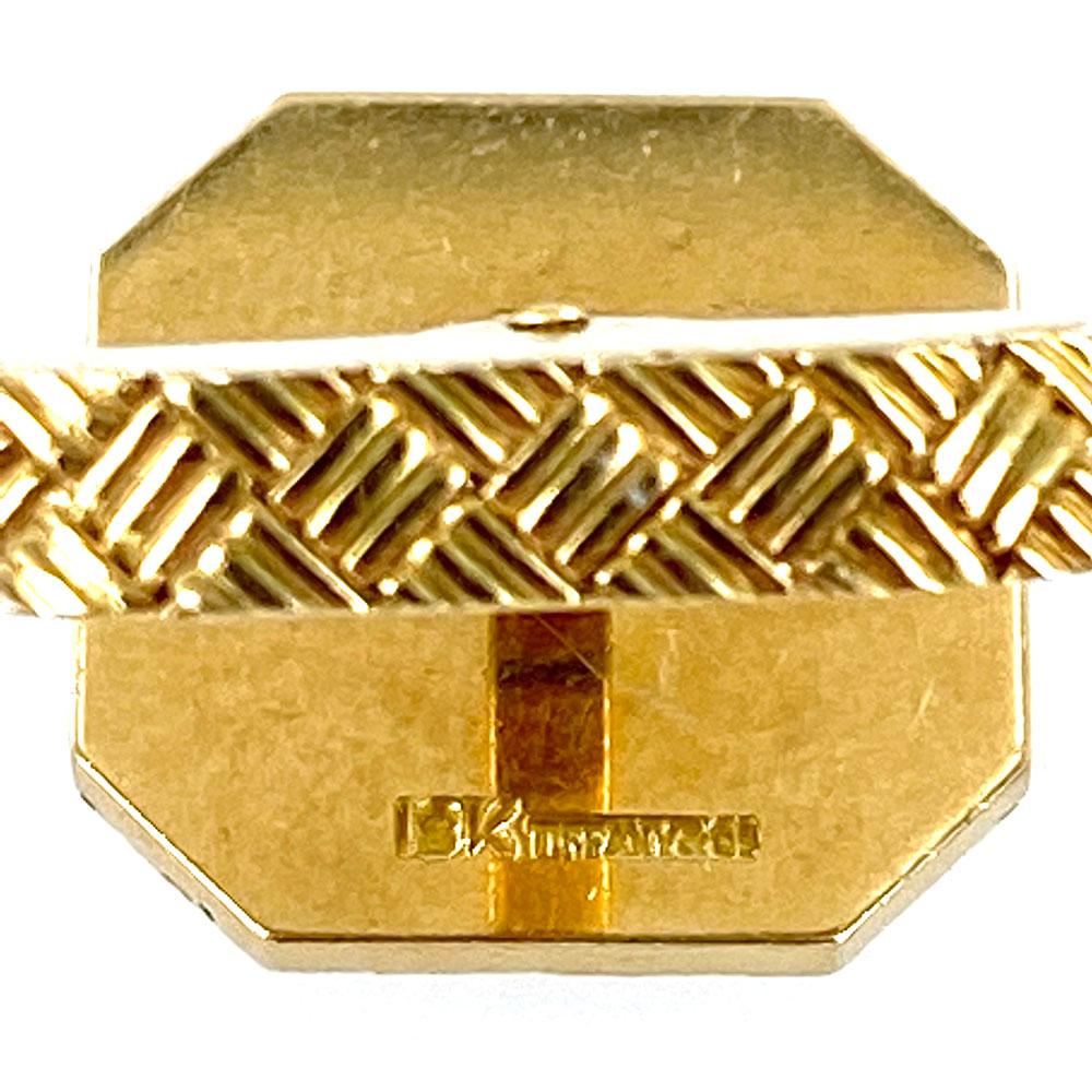 Classy Tiffany & Company cufflink and stud set crafted in 18 karat yellow gold.  The set has a basket weave pattern and each piece is signed 18k Tiffany & Co. The cufflinks measure .75 x .75 inches, and the studs each measure .50 x .50 inches. 