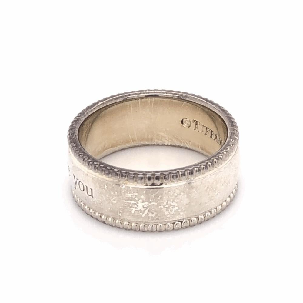 Beautiful, Elegant & finely detailed TIFFANY & CO Beaded I LOVE YOU Band Ring is crafted in Sterling Silver. Size 7. The Ring is in excellent condition and was recently professionally cleaned and polished.  Chic and Classic…A perfect complement to