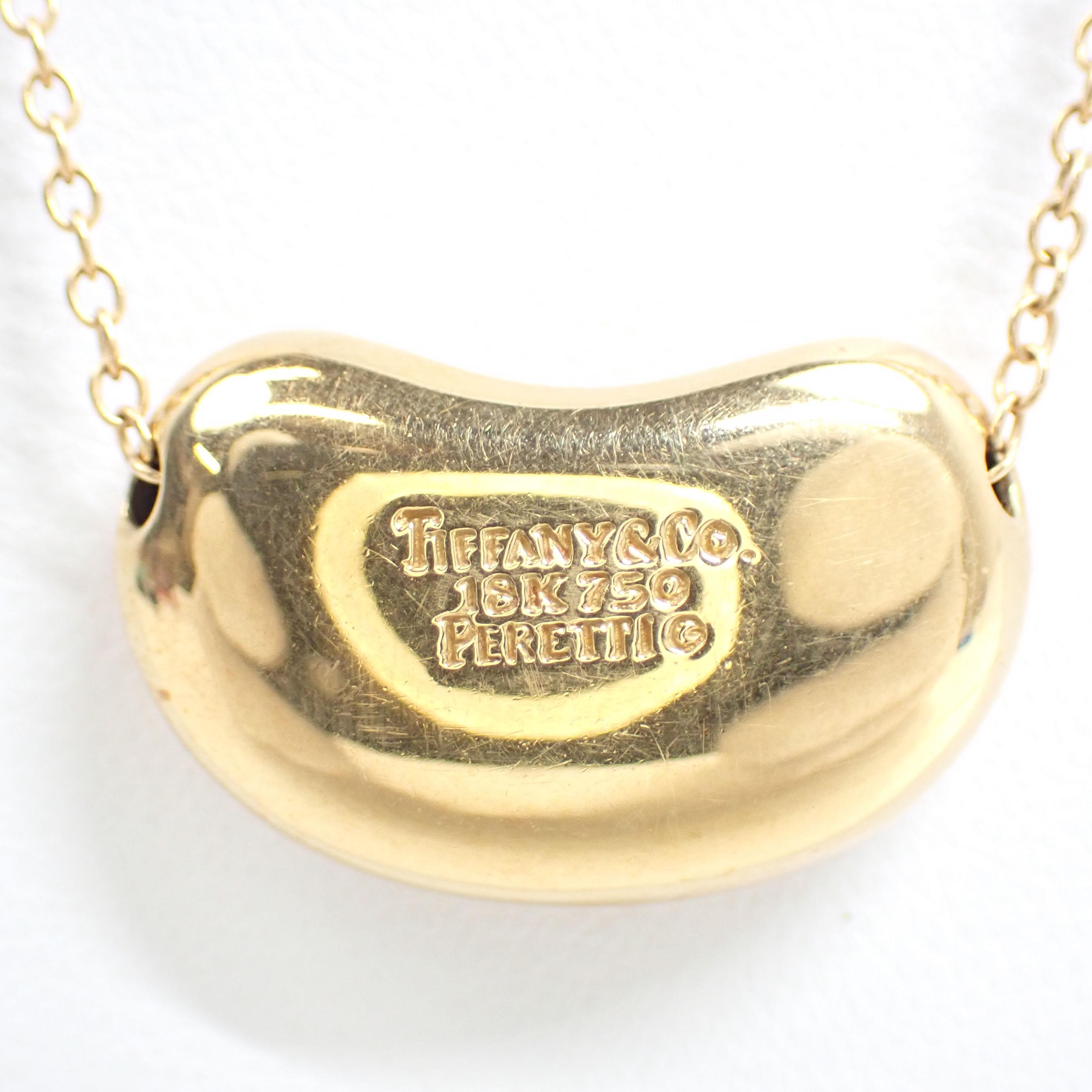 Brand : Tiffany & Co
Description: Tiffany & Co Bean NecklacePendant Colllier 18K Yellow Gold 750
Metal Type:  750YG/YELLOW GOLD
Total Weight:  5.4 g
Width:  14mm
Condition: Preowned; small signs of wearing
Box -  Included
Papers -   Not Included
