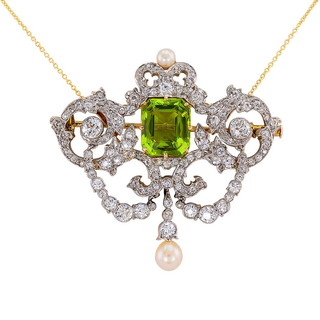Tiffany & Co Belle Epoque peridot diamond pearl gold and platinum brooch pendant circa 1900.
A very rare treasure.

DETAILS:
GEMSTONES:  one emerald-cut Peridot weighing approximately 5.50 carats, plus two pearls measuring 4 mm and 6 mm,