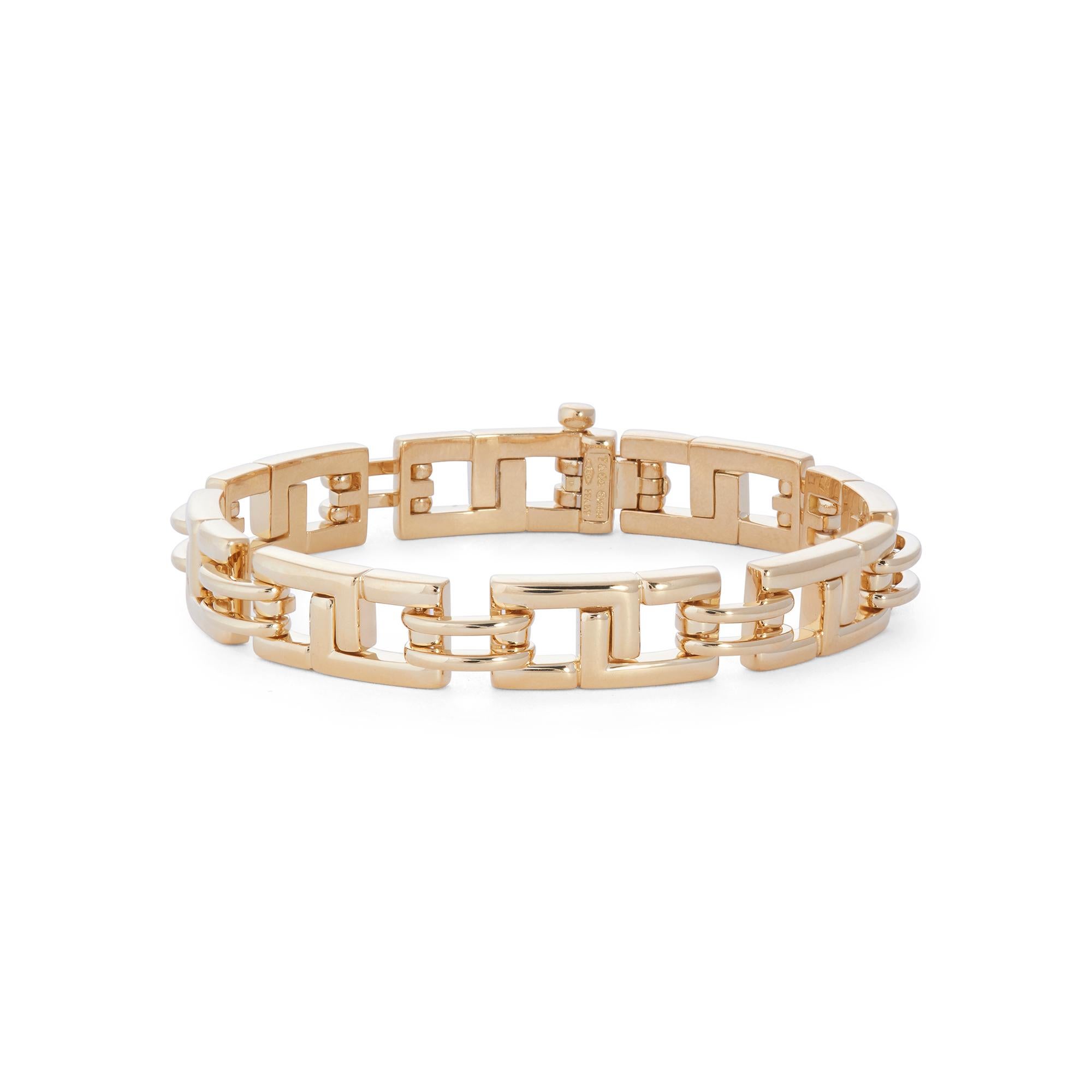 Authentic Tiffany & Co. Biscayne bracelet crafted in 18 karat yellow gold.  Comprised of geometric links of high polished gold measuring 7 1/4 inches in total length and .37 inches wide with a pin clasp.  Signed T & Co., 2001, 750, Italy.  Bracelet