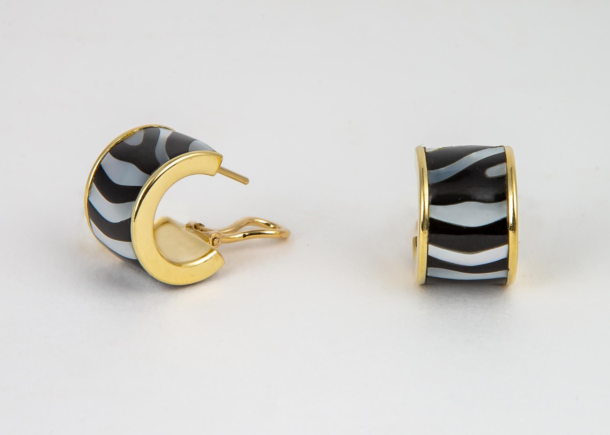 Tiffany & Co. creates a playful zebra stripped pattern combining black jade and beautiful mother of pearl. This could be an every day go to earring. 3/4's of an inch.