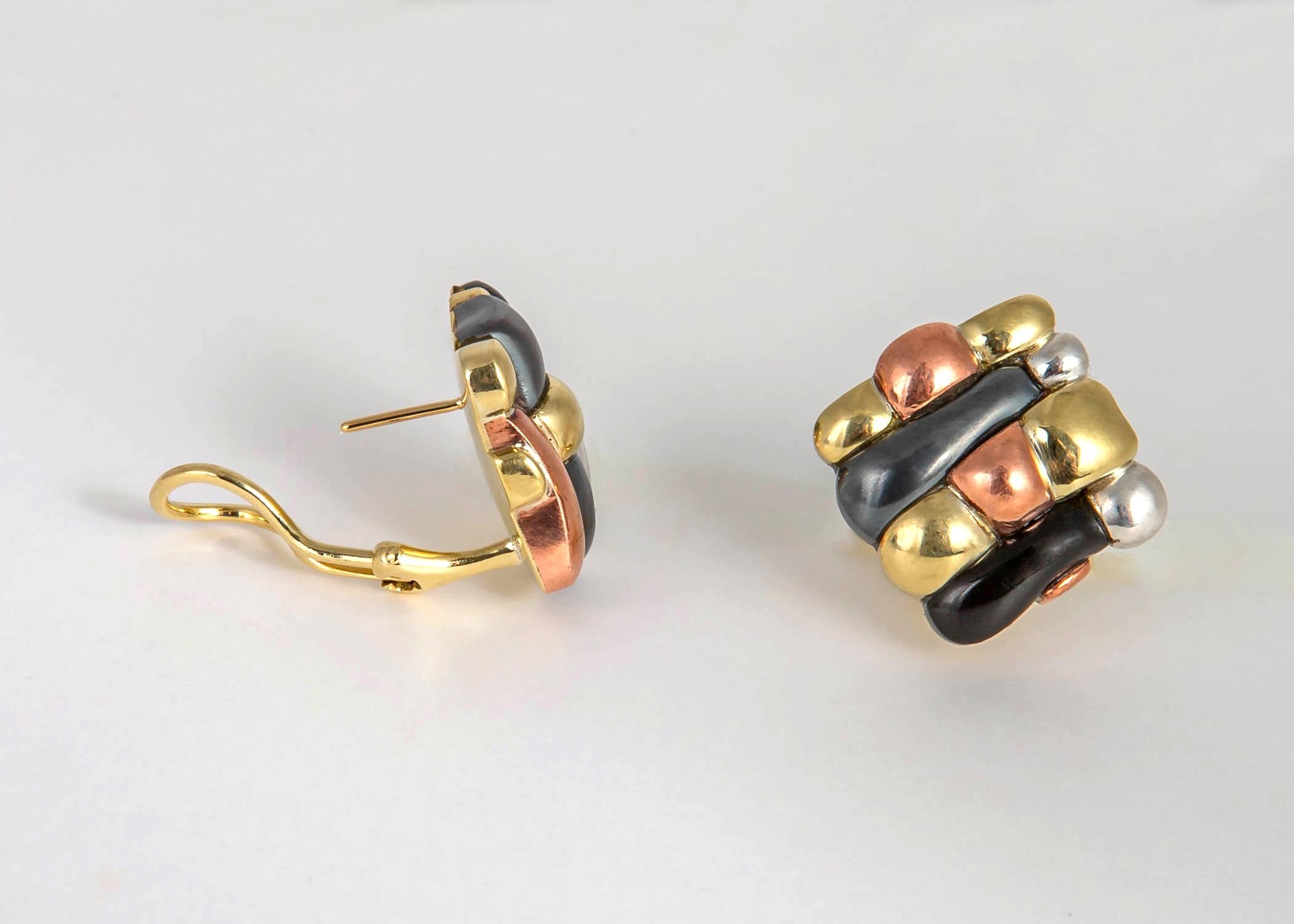 A Chic unique all the time earring. Tiffany & Co. weaves black jade and hematite with 18k gold, sterling silver and copper to create wearable art. 7/8's of an inch in size.