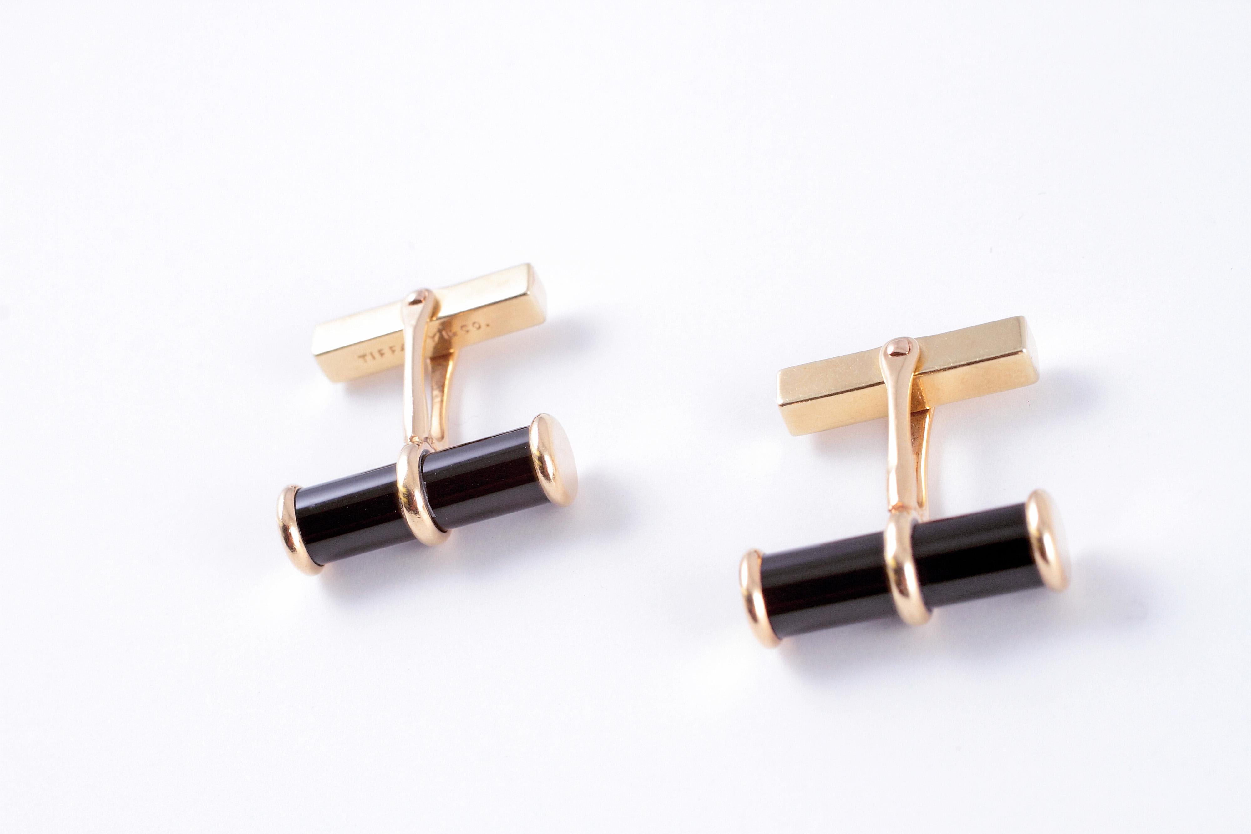 Sleek and stylish black onyx cufflinks in 14 karat gold.  Made by Tiffany & Co.