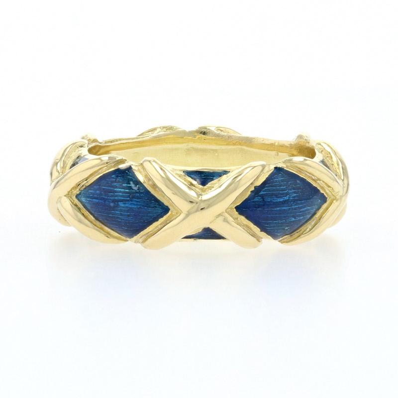Add a colorful touch of pizzazz to your attire with this fabulous designer piece! Created by Tiffany & Co., this high purity 18k yellow gold band showcases a lattice-inspired X design highlighted by rich turquoise blue enameling that spans the