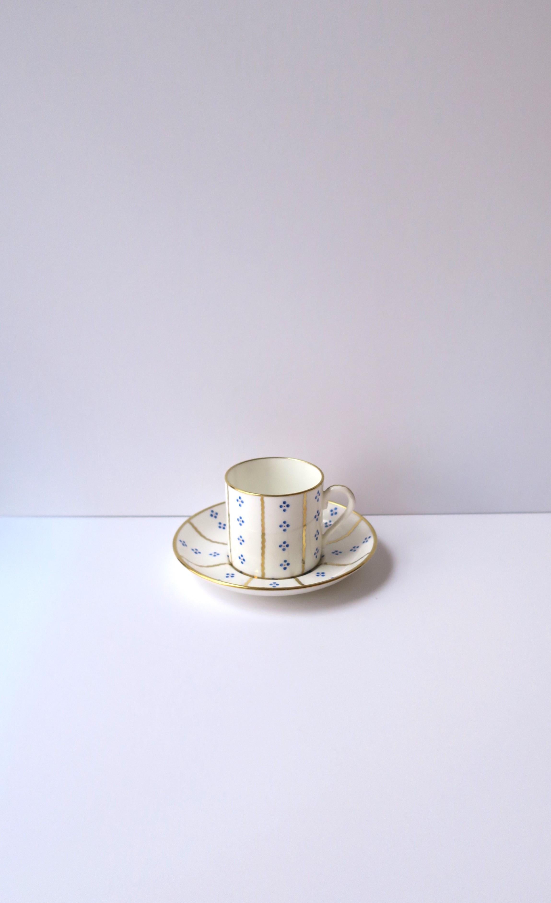 A beautiful blue and gold on white porcelain demitasse coffee or tea cup and saucer set, made exclusively for luxury retailer Tiffany & Co New York, by Hammersley, circa mid-20th century, England. Cup is a 1/2 size cup to traditional cups (aka