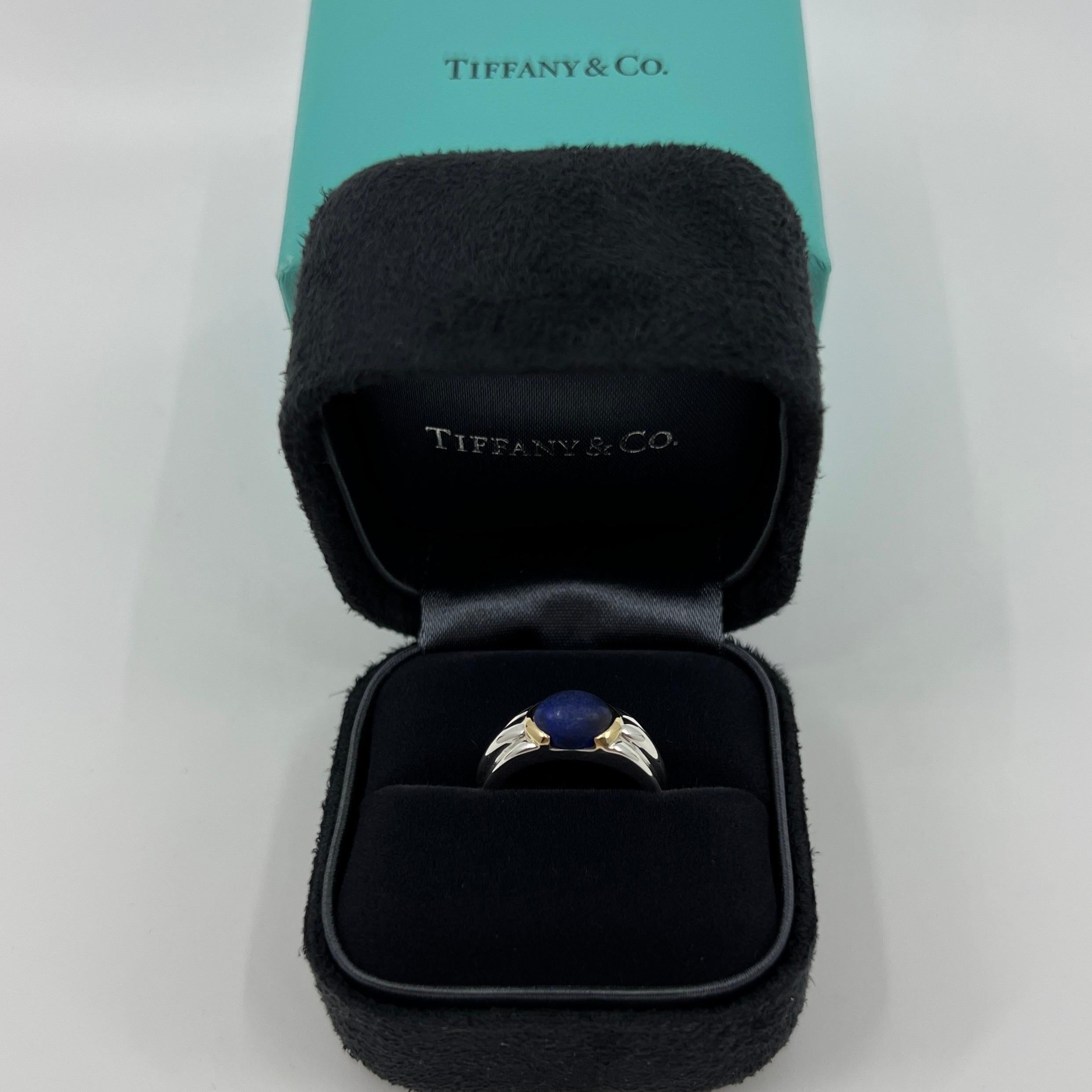 Rare Vintage Tiffany & Co. Blue Oval Cabochon Lapis Lazuli 18k Yellow Gold & Silver Solitaire Ring.

A beautiful and unique design gold and silver ring set with a stunning deep blue 8x6mm cabochon Lapis Lazuli.
Ring is hallmarked/stamped Tiffany &