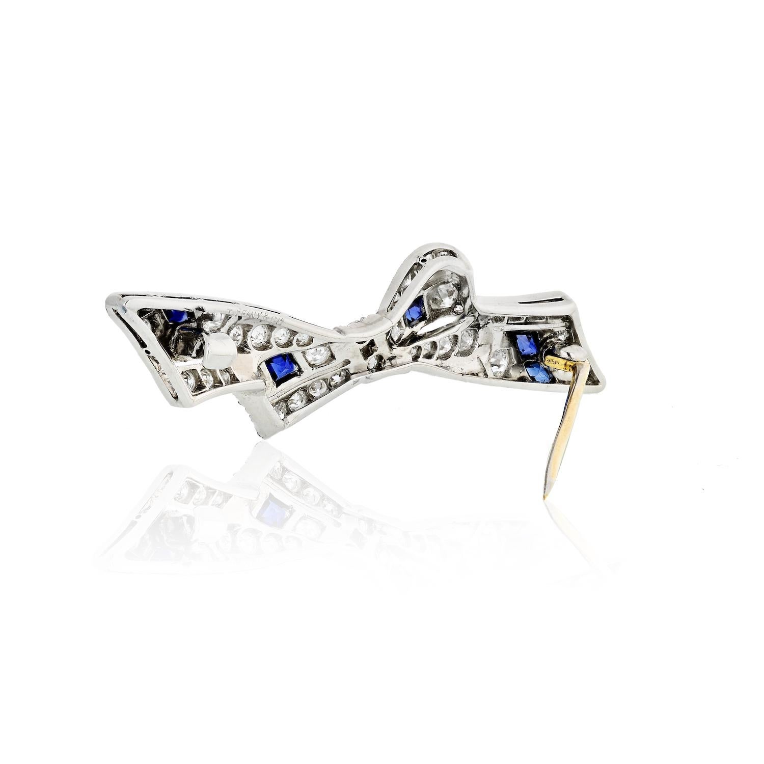 Modern Tiffany & Co. Blue Sapphire and Diamond Bow Platinum Brooch