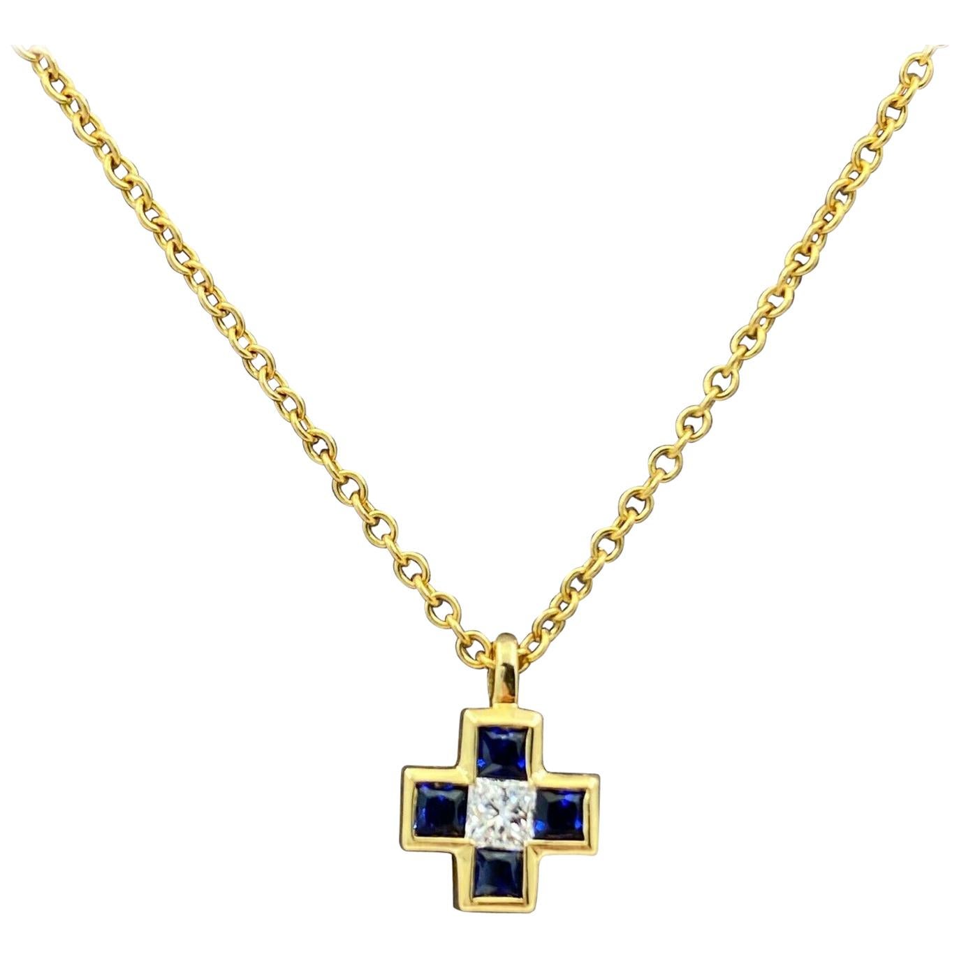 Tiffany & Co. Blue Sapphire Diamond Mini Cross 18 Karat Gold Pendant Necklace