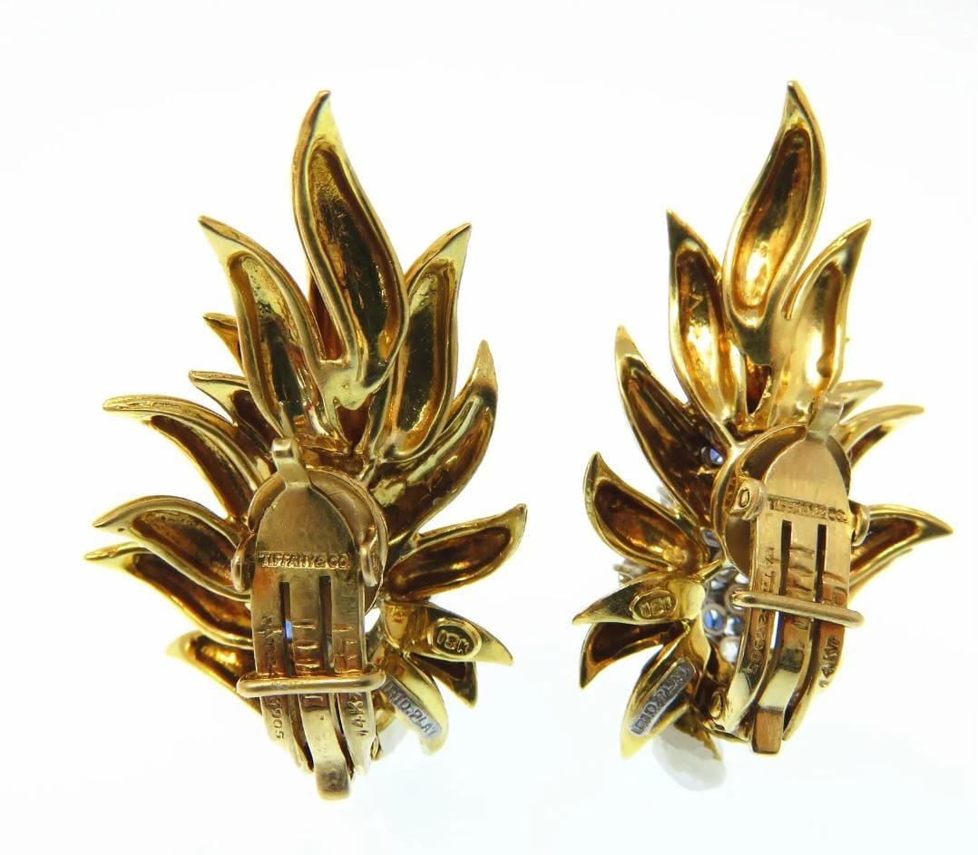 Tiffany & Co 750

Diamonds and sapphires 

Marked: 18k IRID Plat on earrings and 14k Pat 2423905 on clip

Earrings are about 39 x 27mm

Total Weight: 23.5 grams