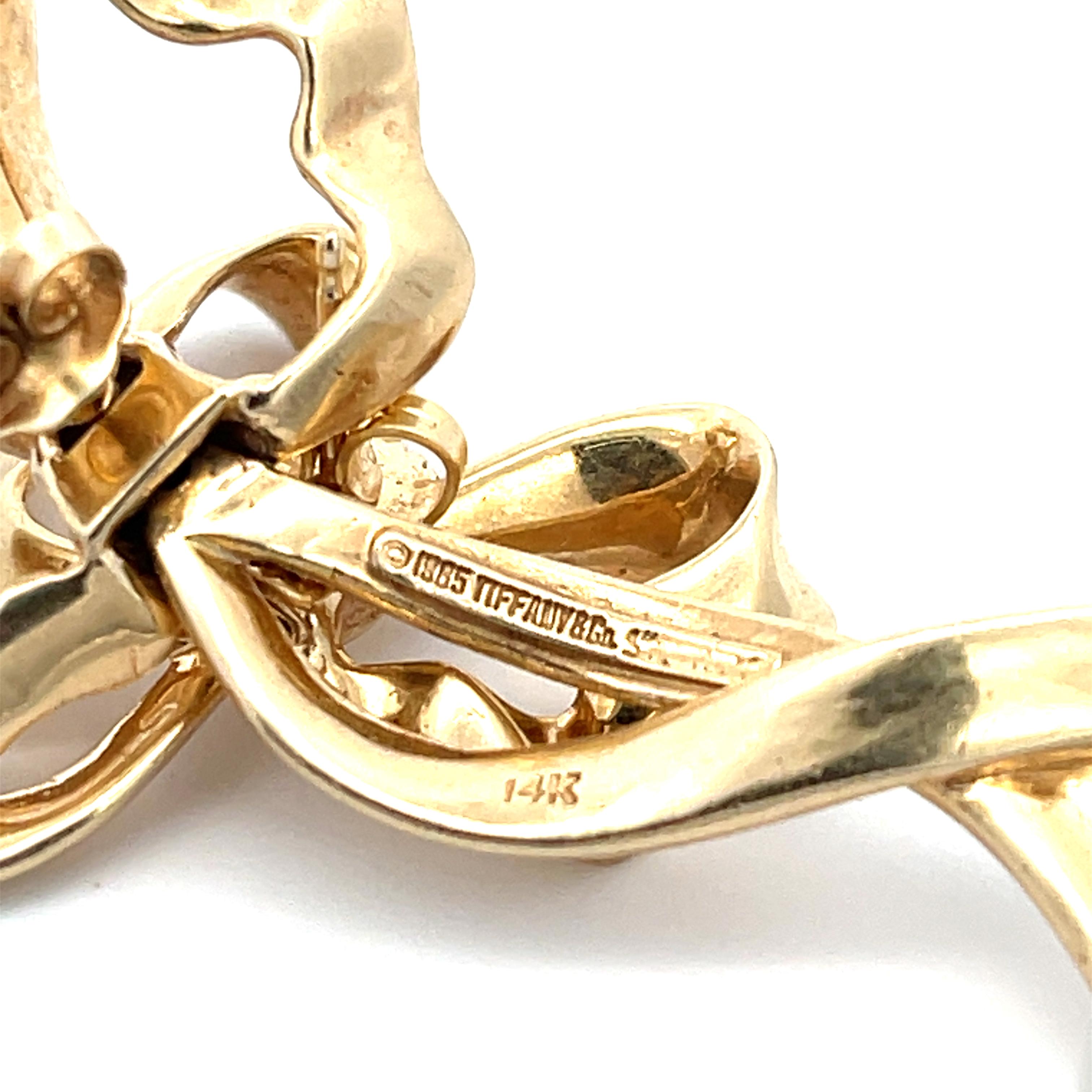 Tiffany & Co. Bow Earrings in 14K Yellow Gold. The earrings are 2.5