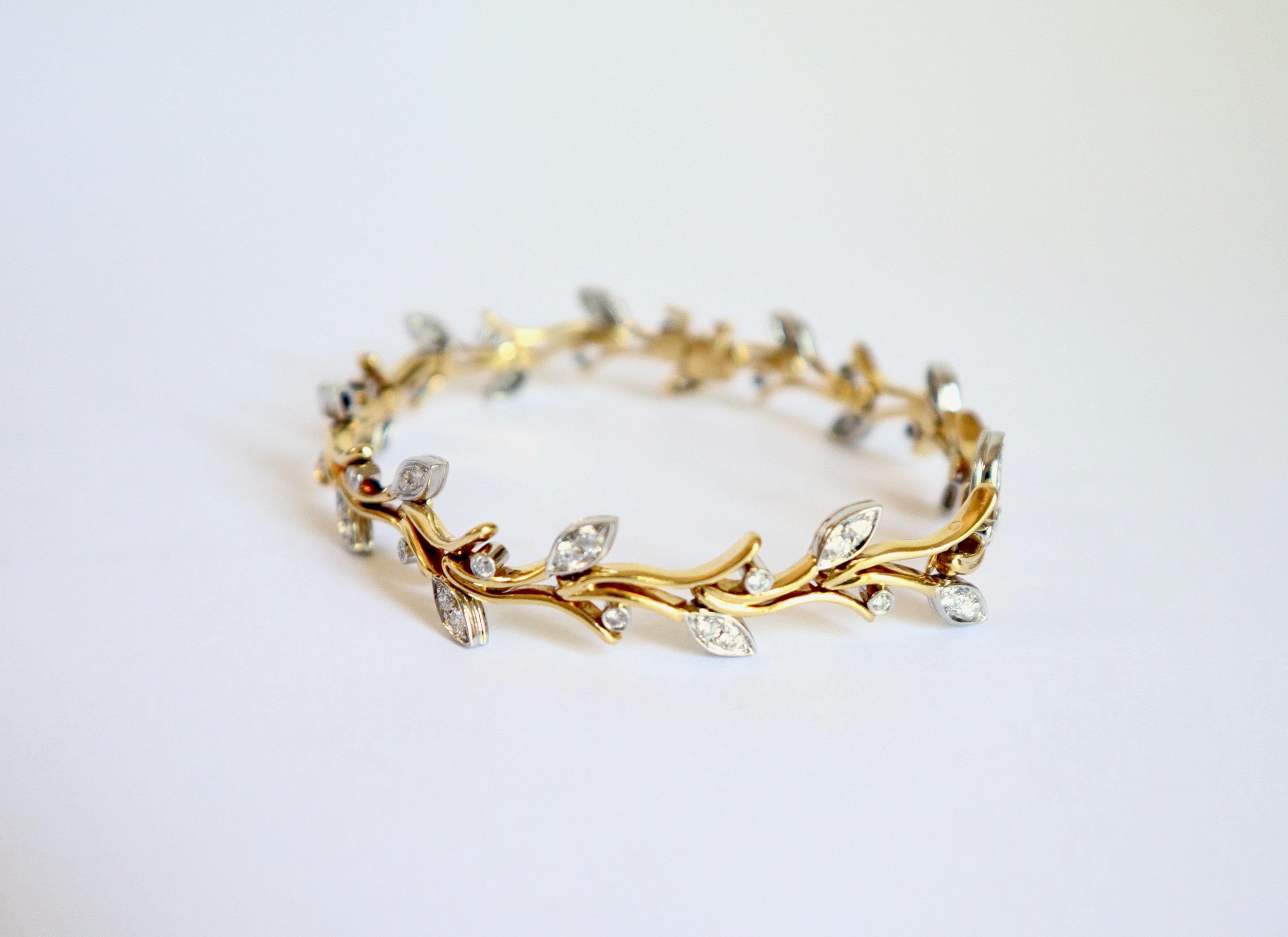 TIFFANY'S Bracelet in 18 Carat yellow Gold, Platinum and Diamonds, Twig Shape
18 Diamond-set Leafs motifs. 
The Bracelet is signed Tyffany's  and dated 1999
Gross weight: 25,2g
Length 17.5 cm
Width 1cm