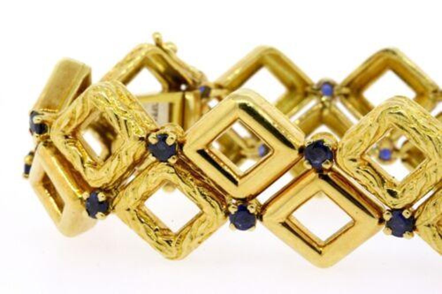 Here we have a Tiffany & Co. vintage 18k gold sapphire bracelet with incredible etches and smooth squares design 8