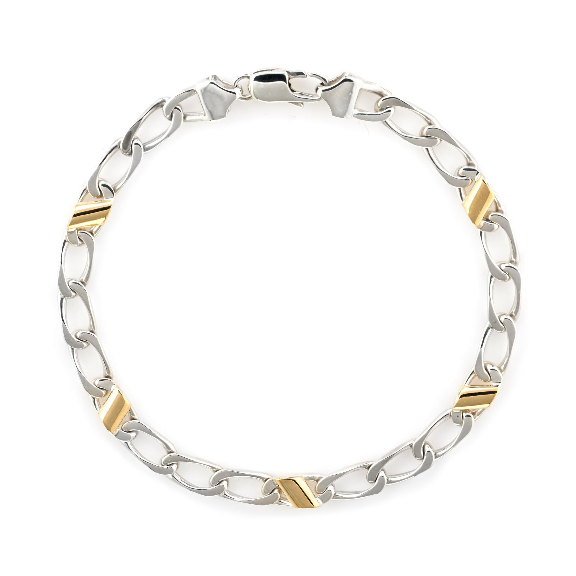 Stylish and finely detailed vintage Tiffany & Co curb link bracelet, crafted in sterling silver with 18k yellow gold accents.  

The curb link bracelet features five 18k yellow gold bar accents. The bracelet is great worn alone or layered with your