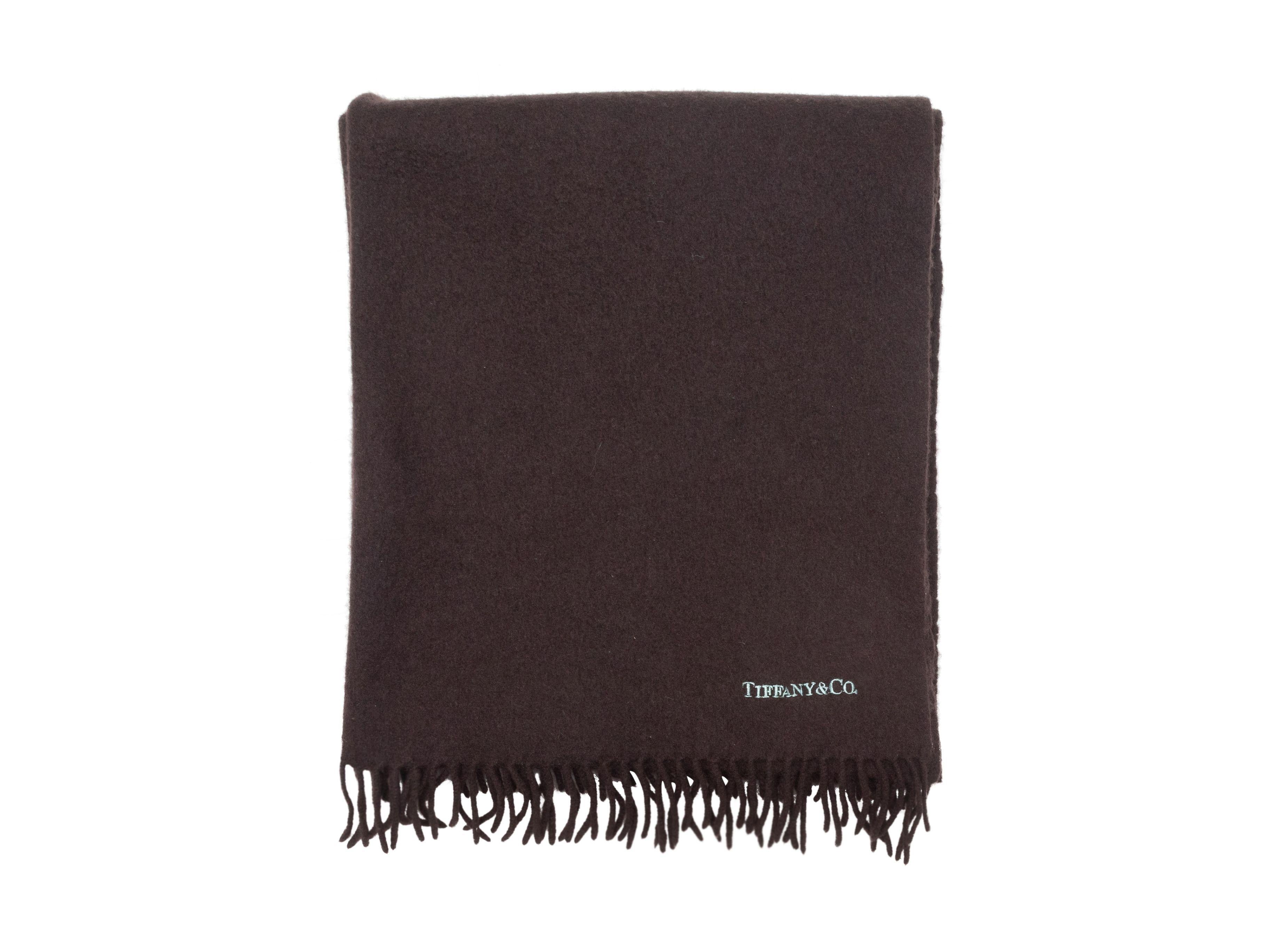 Product Details: Brown cashmere scarf by Tiffany & Co. Fringe trim at ends. 26.5
