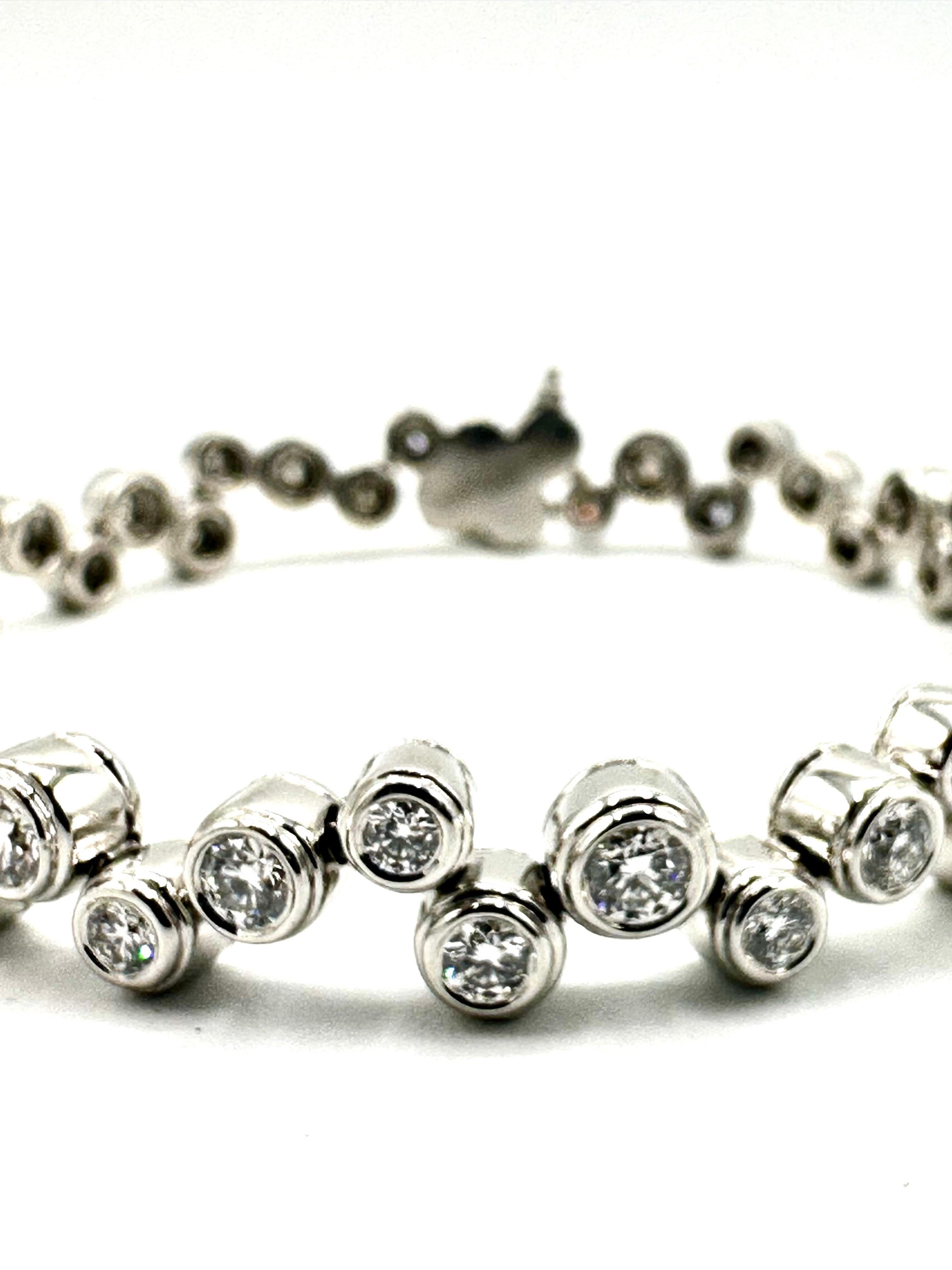 Beautiful, elegant Tiffany & Co. Bubbles bracelet.  Bezel-set
ultra brilliant diamonds dance across the wrist like effervescent
bubbles.  Set in platinum; 3.65cts of Diamonds.  Exceptional quality.  A festive bauble for the Holidays.  Offered by