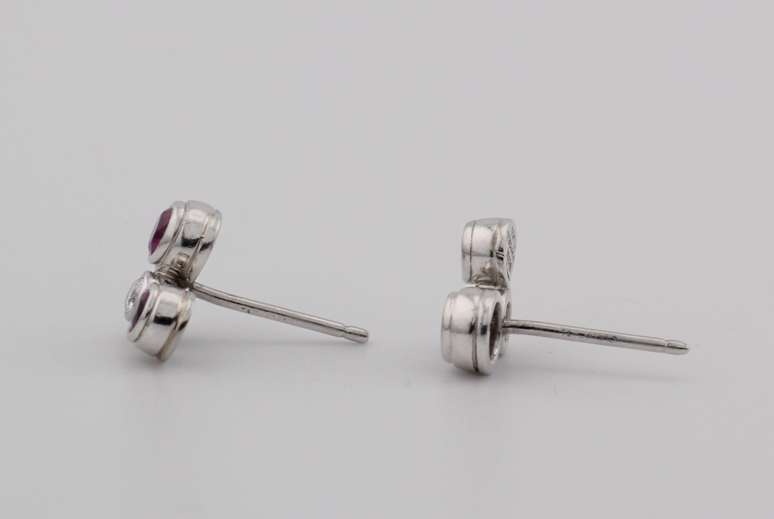 Experience the refined elegance of Tiffany & Co. with these stunning Platinum Stud Earrings. Meticulously crafted, these earrings are a symbol of luxury and sophistication.

Each earring showcases round-cut rubies, complemented by a brilliant-cut