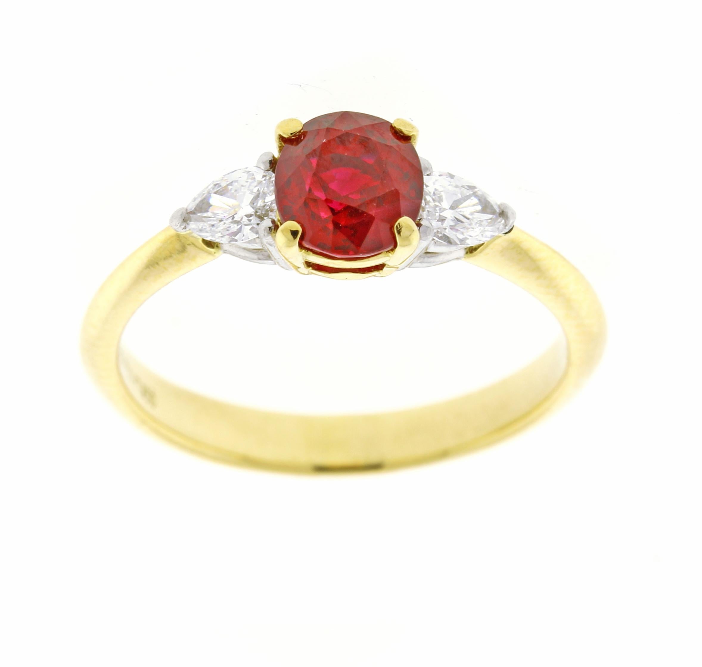 From Tiffany & Co. a Vivid red ruby and pear shape diamond ring.
♦ Designer: Tiffany & Co
♦ Metal: 18 karat and platinum
♦ Oval Heated Burma Ruby=1.02 carats
♦ 2 Diamonds=.23
♦ Circa 1990
♦ Size 6, Resizable
♦ Packaging: Tiffany Box
♦ Condition: