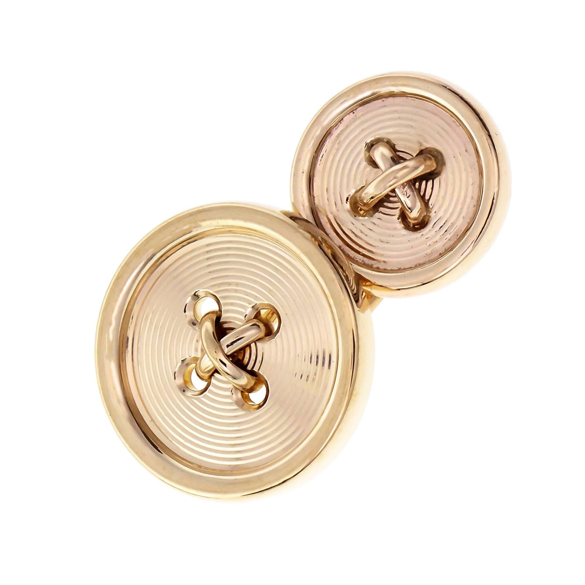  Tiffany & Co cufflinks. Button design double sided 14k yellow gold.

14k yellow gold
Front 
Top to bottom: 19.4mm or .76 inch 
Width: 19.4mm or .76 inch 
Depth: 6.2mm 
Back 
Top to bottom: 14.07mm or .55 inch 
Width: 14.21mm or .55 inch 
Depth: