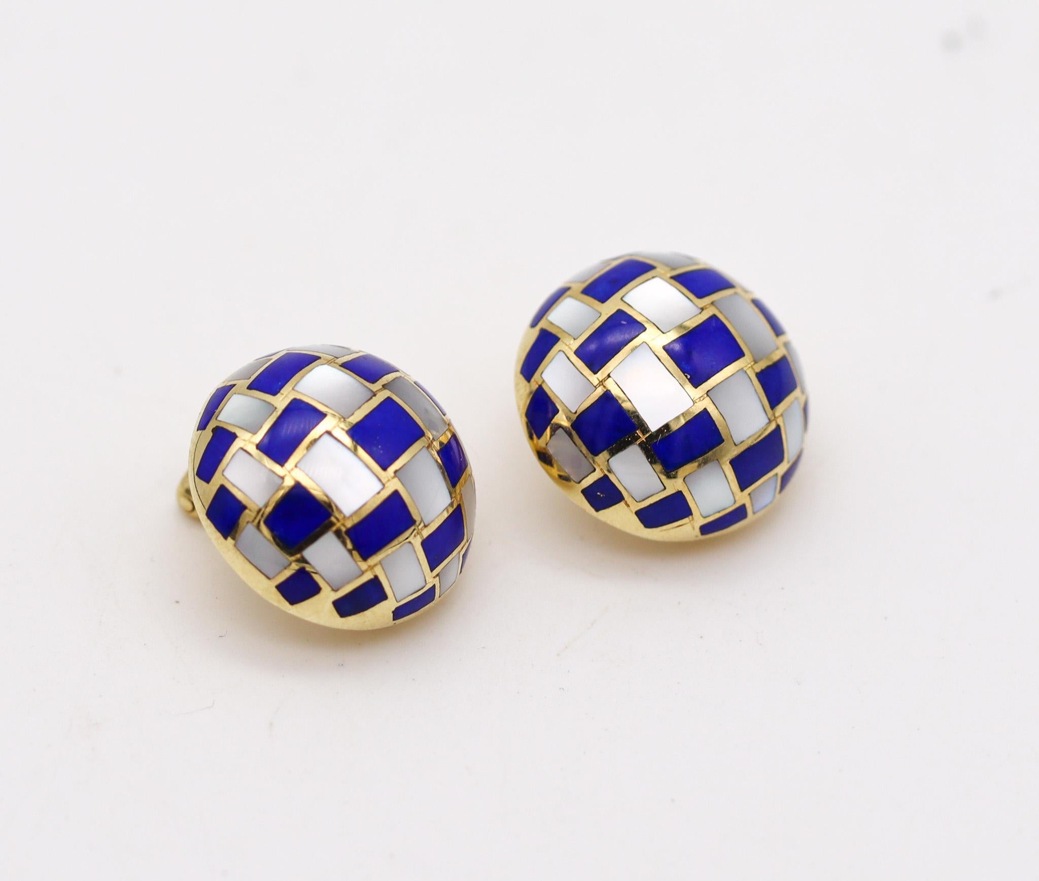Geometric earrings designed by Angela Cummings for Tiffany & Co.

Beautiful geometric pair of ear clips, created by Angela Cummings in New York city, back in the 1979. This pair of domed bombe earrings were carefully crafted in solid yellow gold of