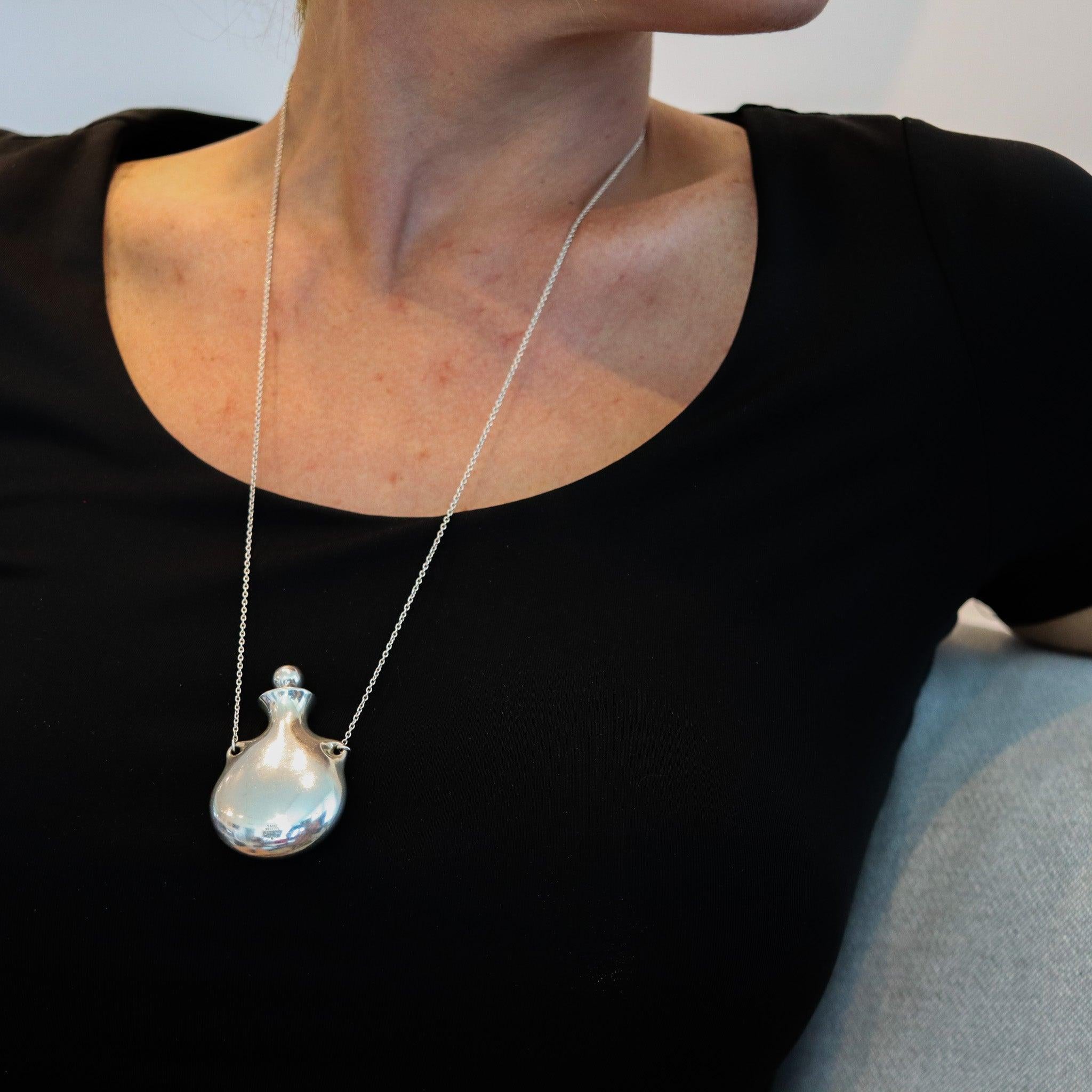 Bottle necklace designed by Elsa Peretti (1940-2019) for Tiffany & Co.

This is a gorgeous freeform bottle with lid necklace, created by Elsa Peretti for the Tiffany Studios back in the 1978. The iconic vintage pendant-necklace has been crafted at