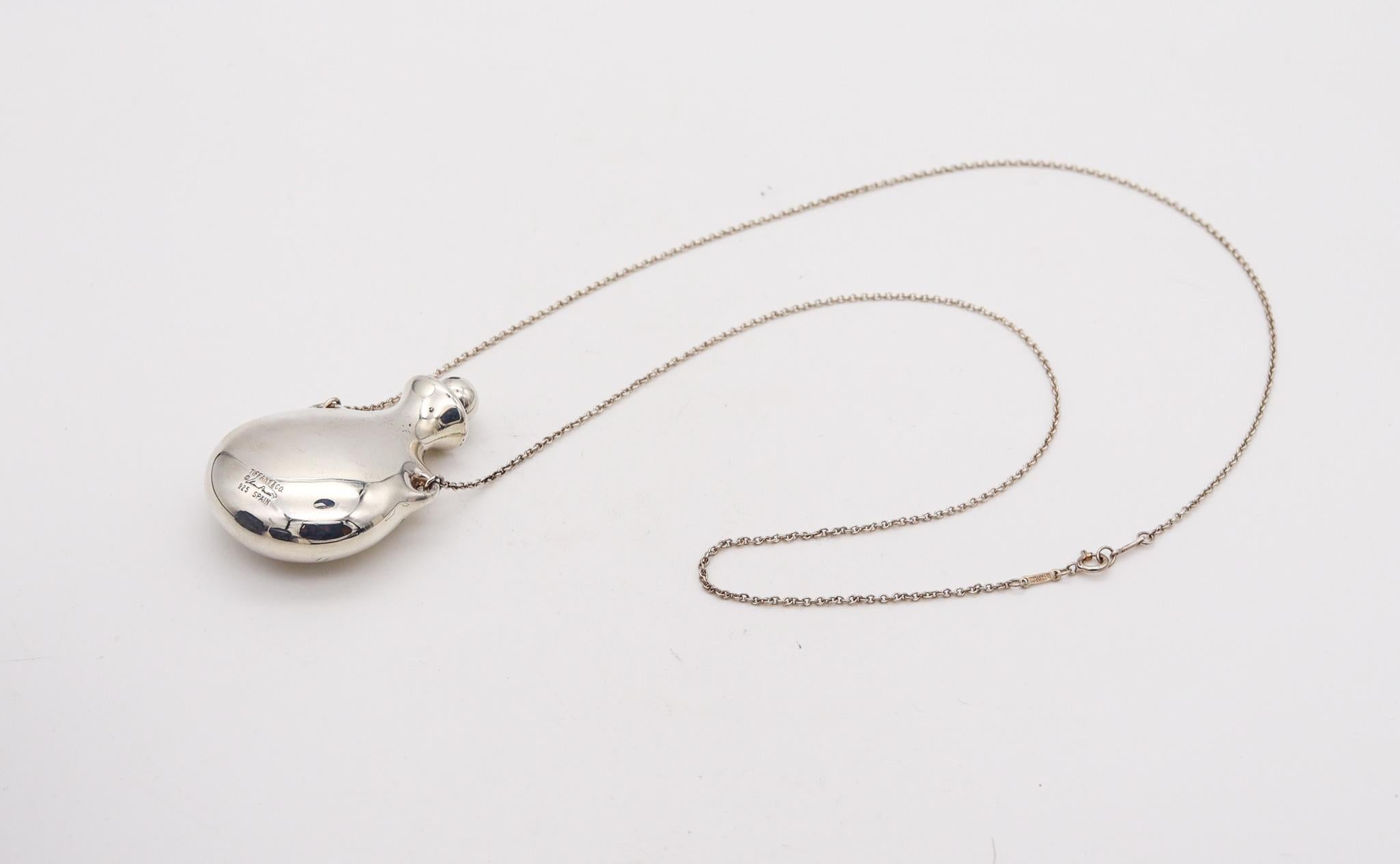 Bottle necklace designed by Elsa Peretti (1940-2019) for Tiffany & Co.

Fabulous freeform open bottle created by Elsa Peretti for the Tiffany Studios back in the 1978. This iconic vintage pendant necklace has been crafted at the Tiffany Studios in