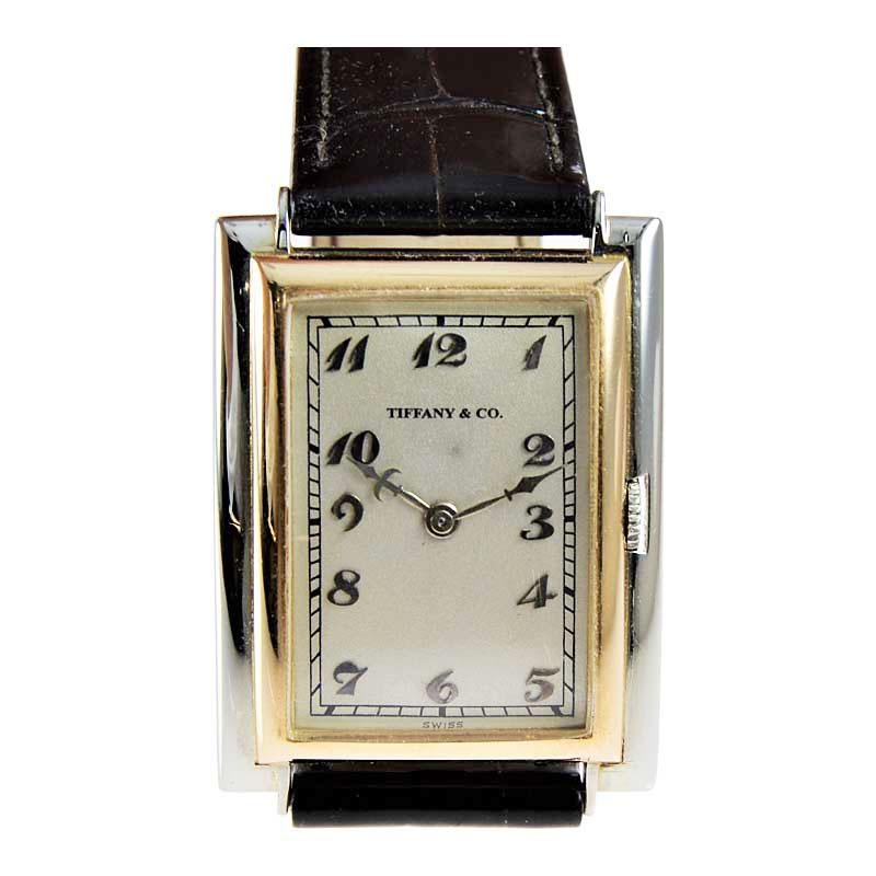 FACTORY / HOUSE: Tiffany & Co. / by Jules Jurgensen
STYLE / REFERENCE: Art Deco
METAL / MATERIAL: 18 Kt. White and Rose Gold
DIMENSIONS: Length 39mm  X Width 27mm
CIRCA: 1930'S
MOVEMENT / CALIBER: 10 Ligne / 17 Jewels / Manual Winding
DIAL / HANDS: